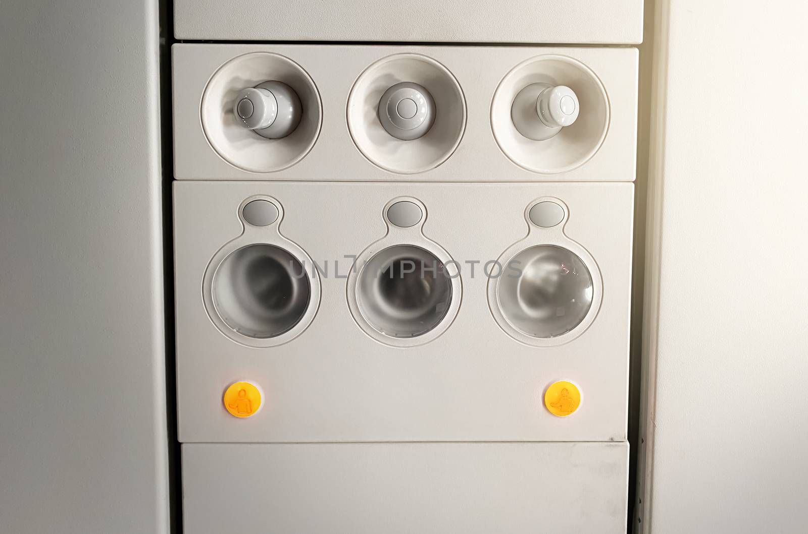 Adjustable lights and air conditioners overhead seat controls of a commercial aircraft in an airplane by rarrarorro