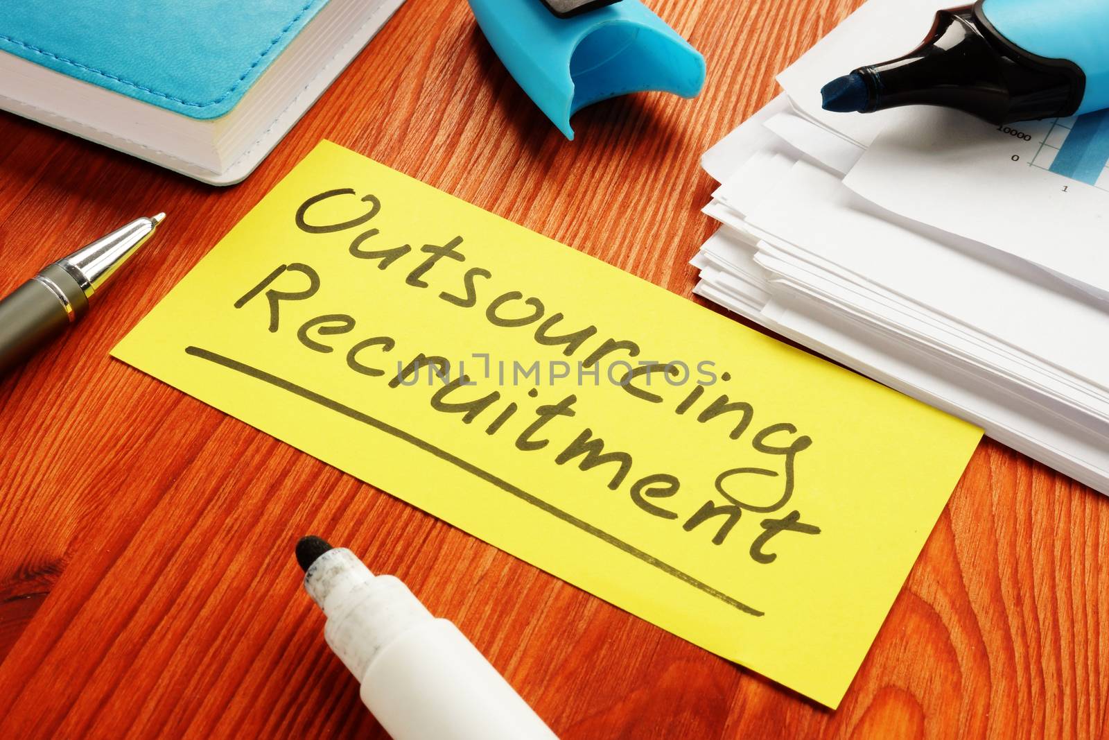 Outsourcing recruitment memo sign about HR process of delegation.