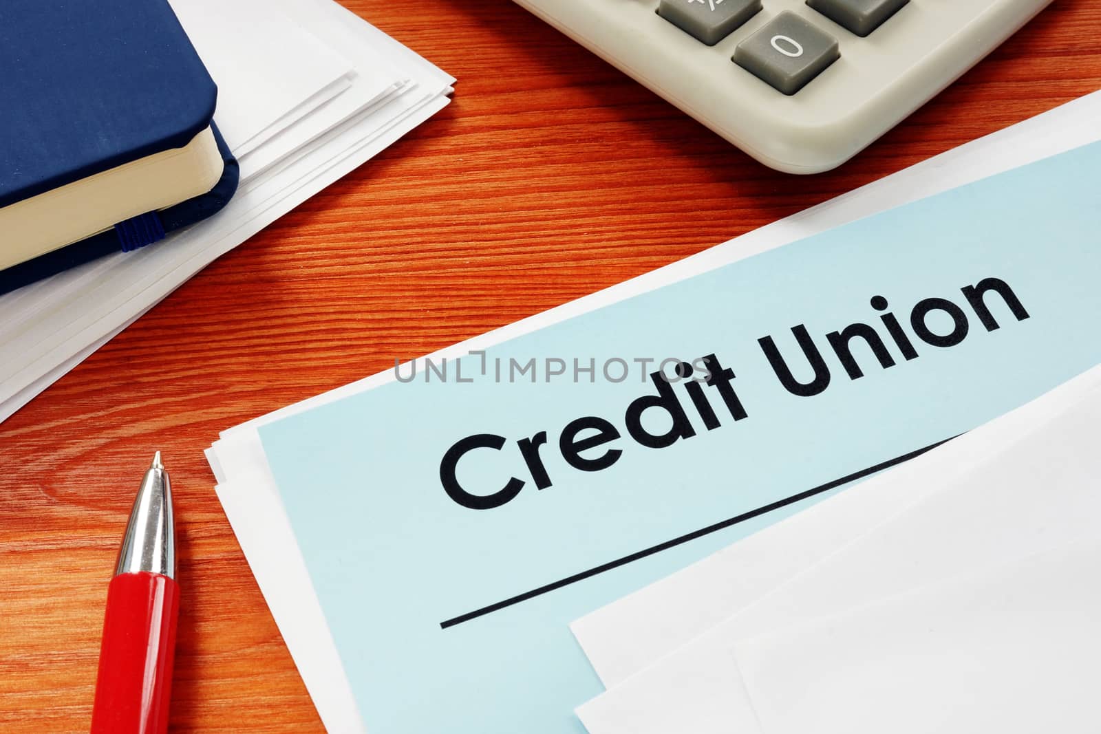 Credit Union papers for loan on desk. by designer491