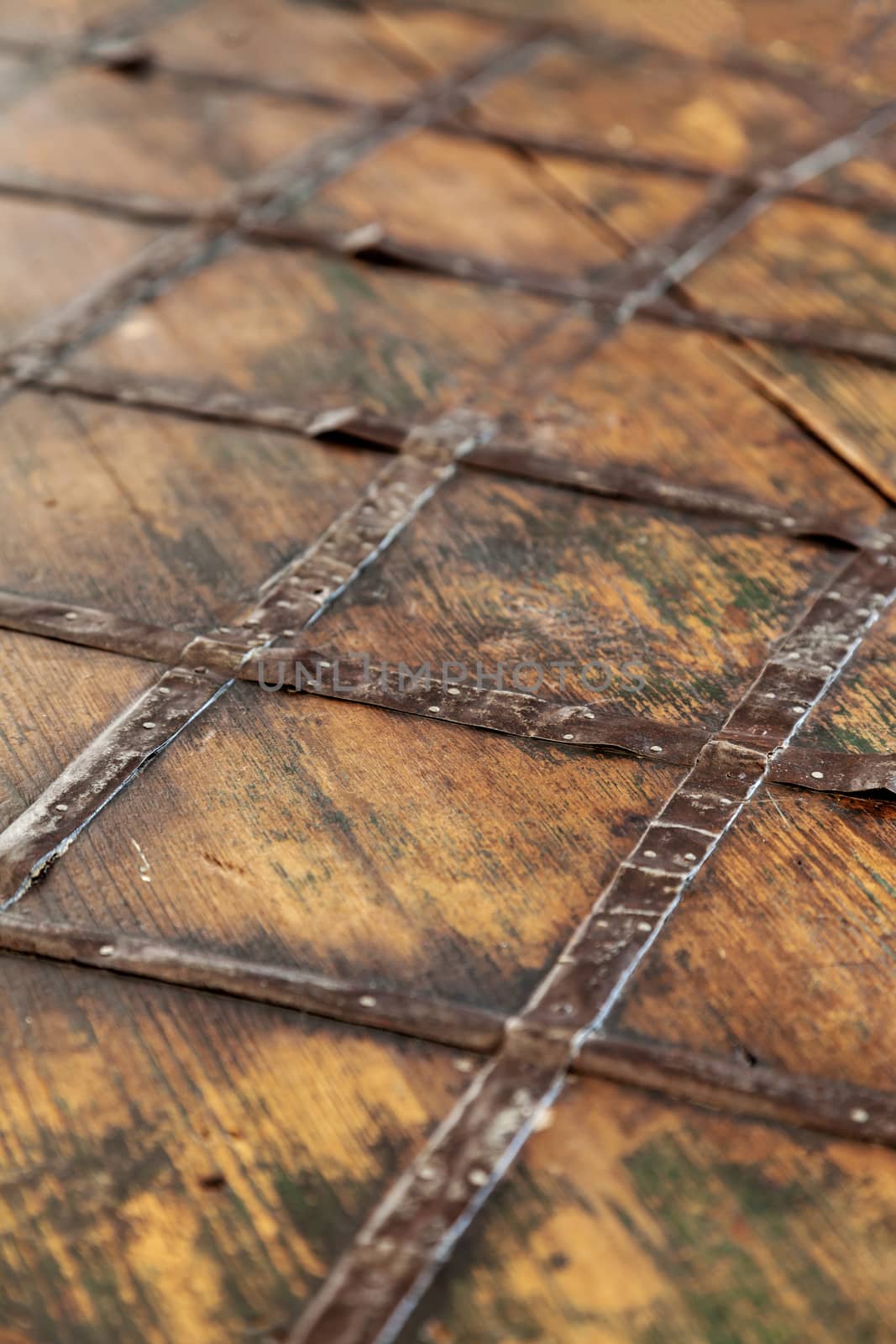 Fragment of an old brown wooden chest. by sveter