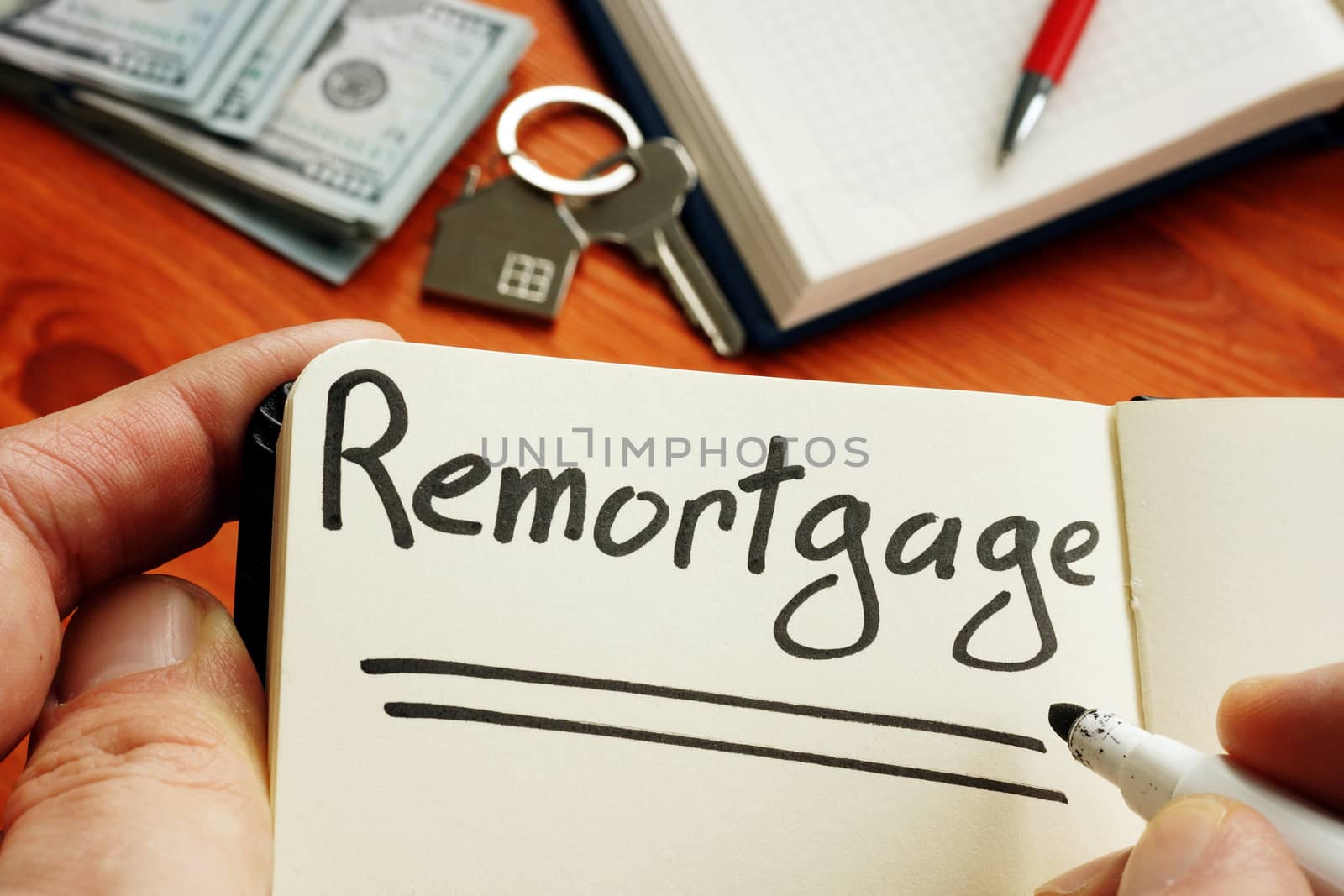 Remortgage handwritten word by man. by designer491