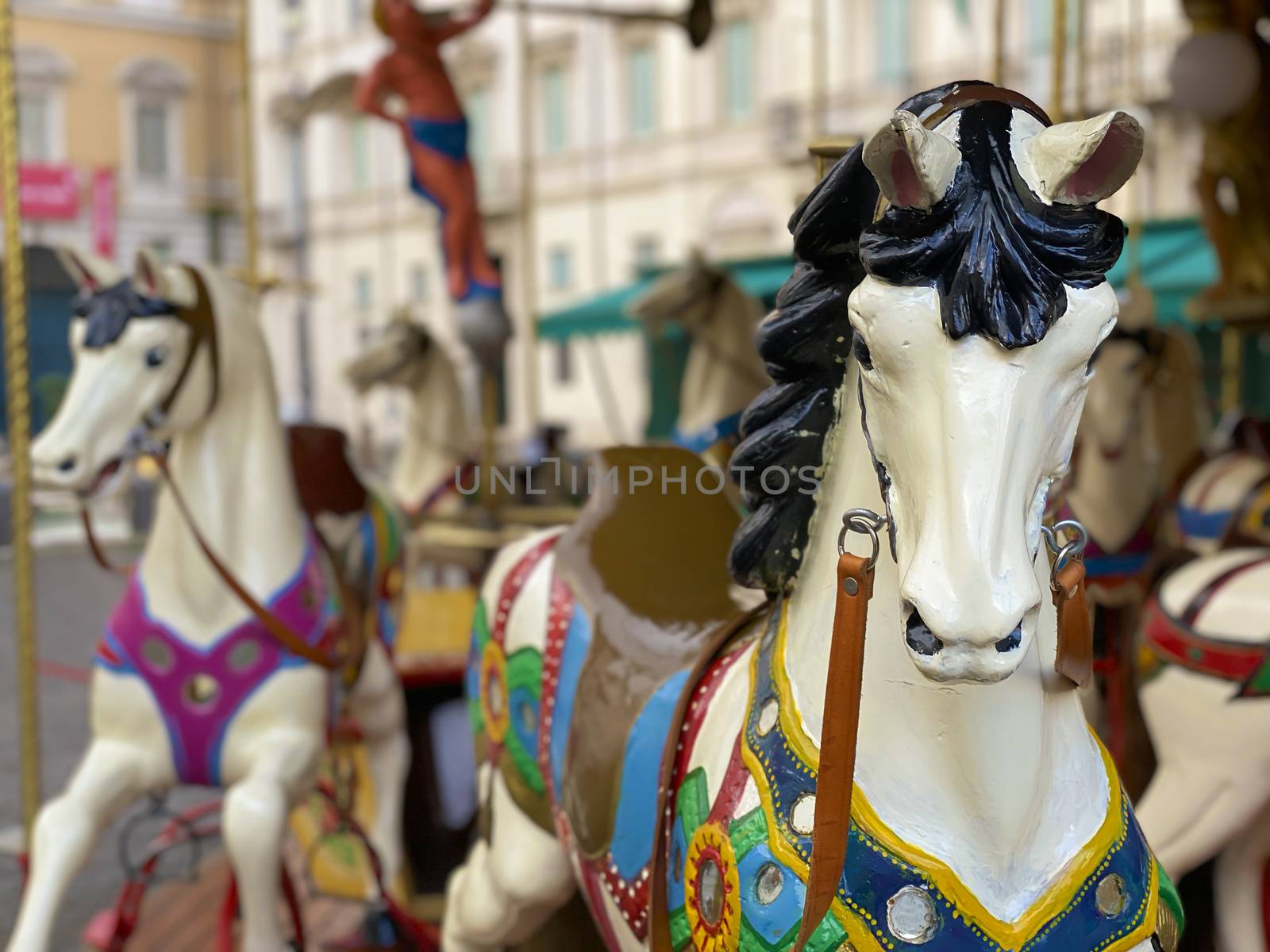 close-up of a white horse of an ancient carousel. Fun and play. Childhood and traditions