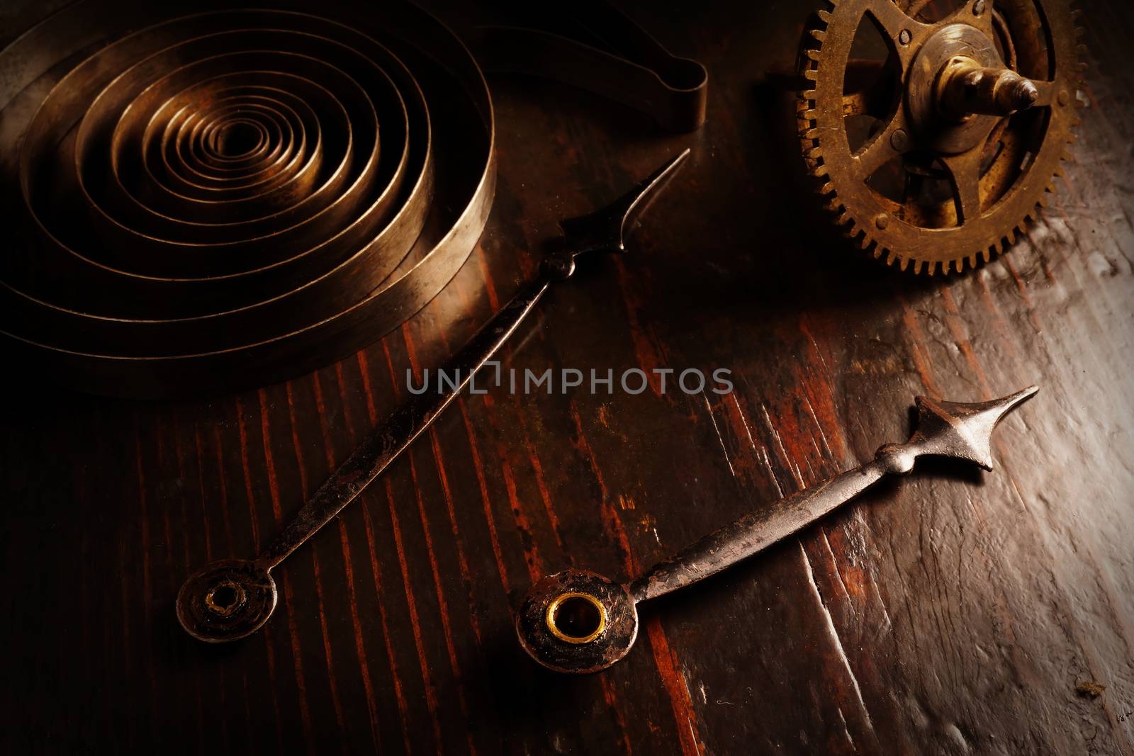 Vintage retro watch mechanism gears and clock hands background. Waste of time.