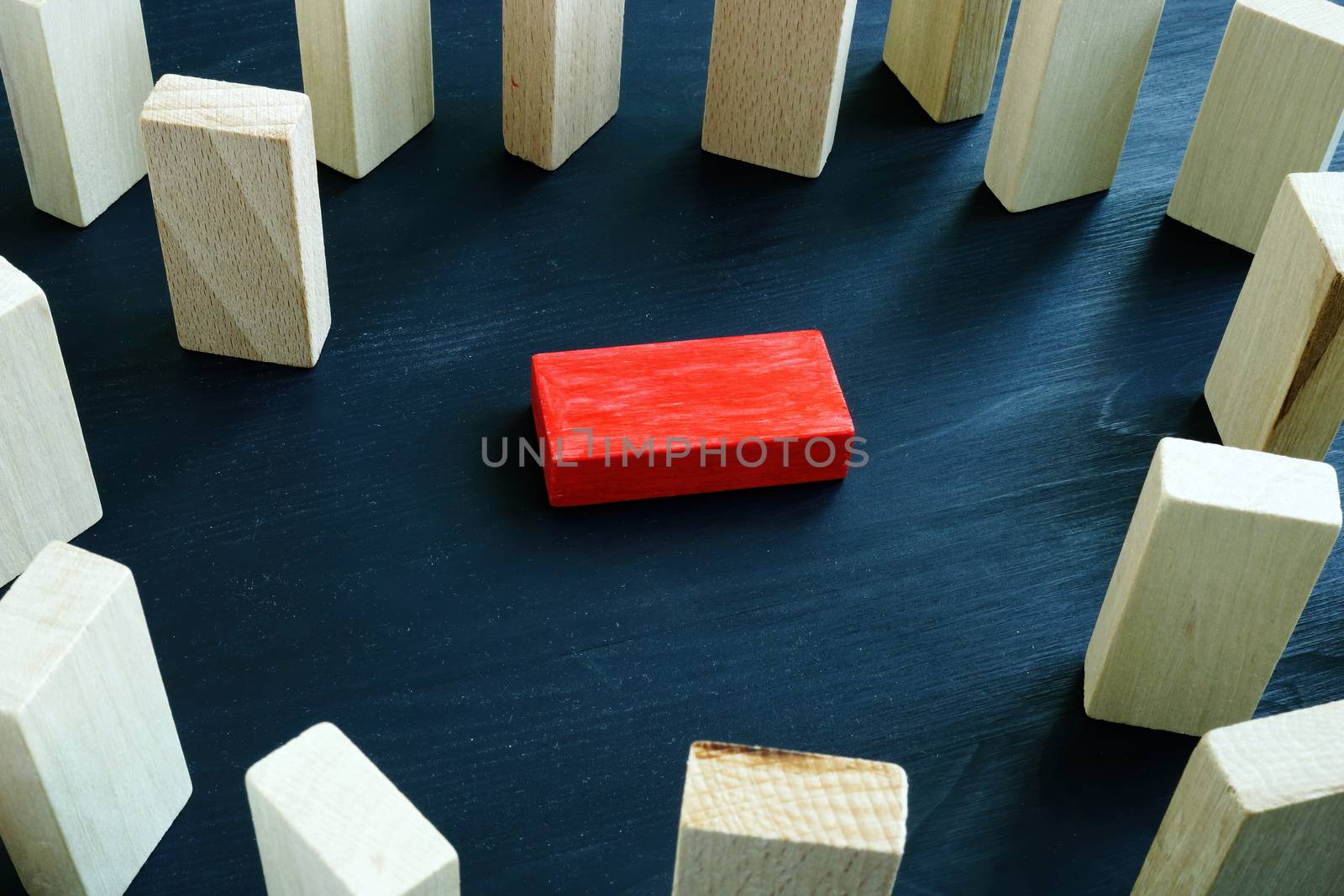 Victimization and discrimination concept. Lying red block and wooden.