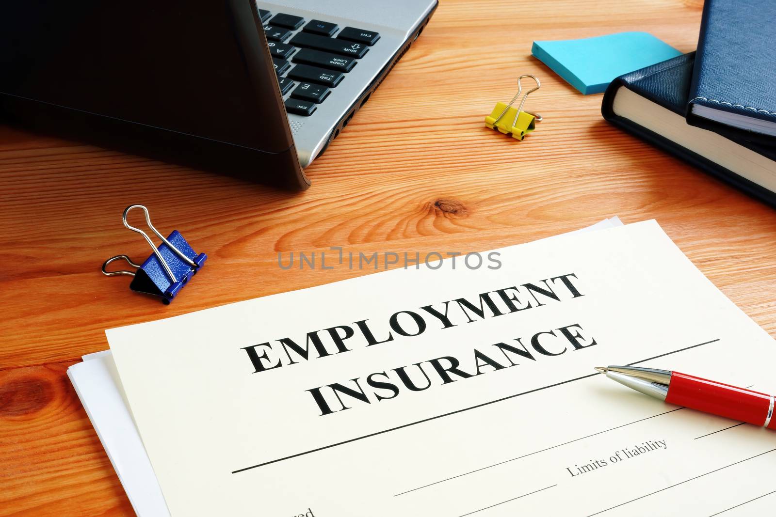 Unemployment insurance application form for signing.