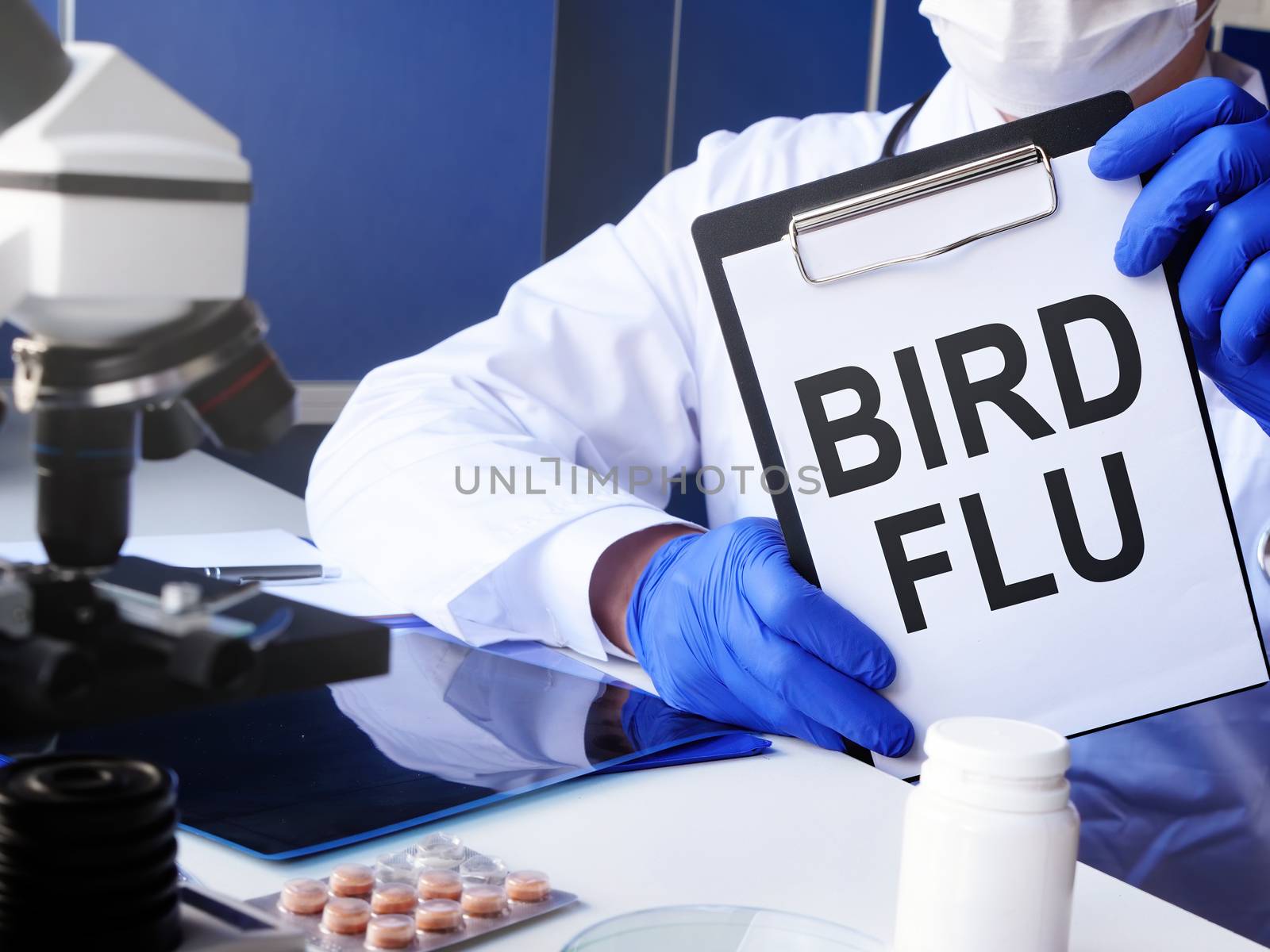 Doctor holds Bird flu diagnosis in the clinic.