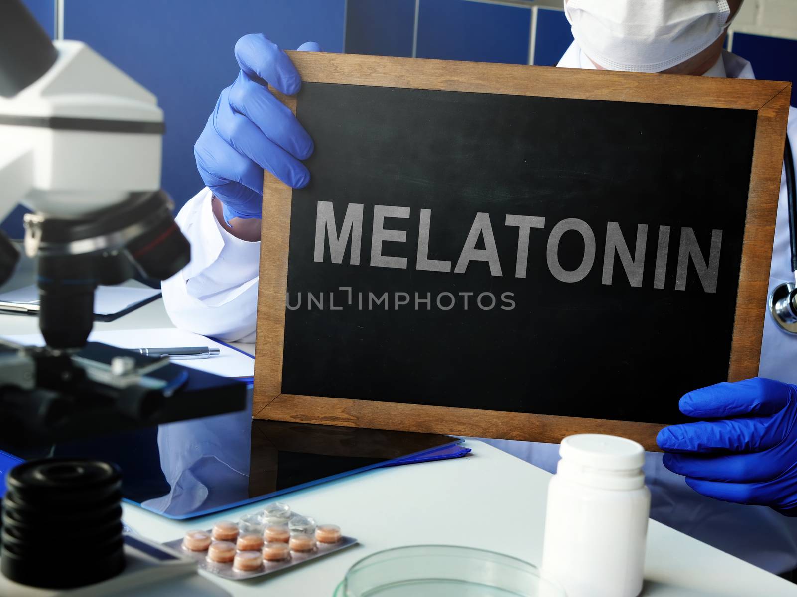 Melatonin hormone on the blackboard in the laboratory.