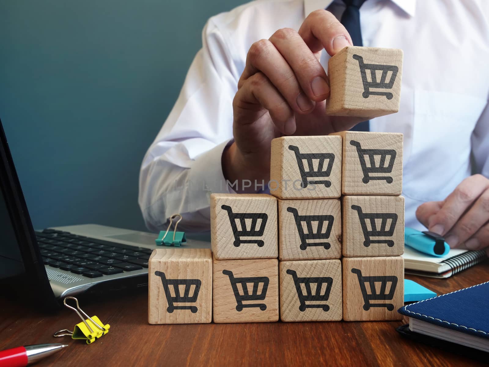 Retail and Sales growth concept. Cubes and shopping cart signs.