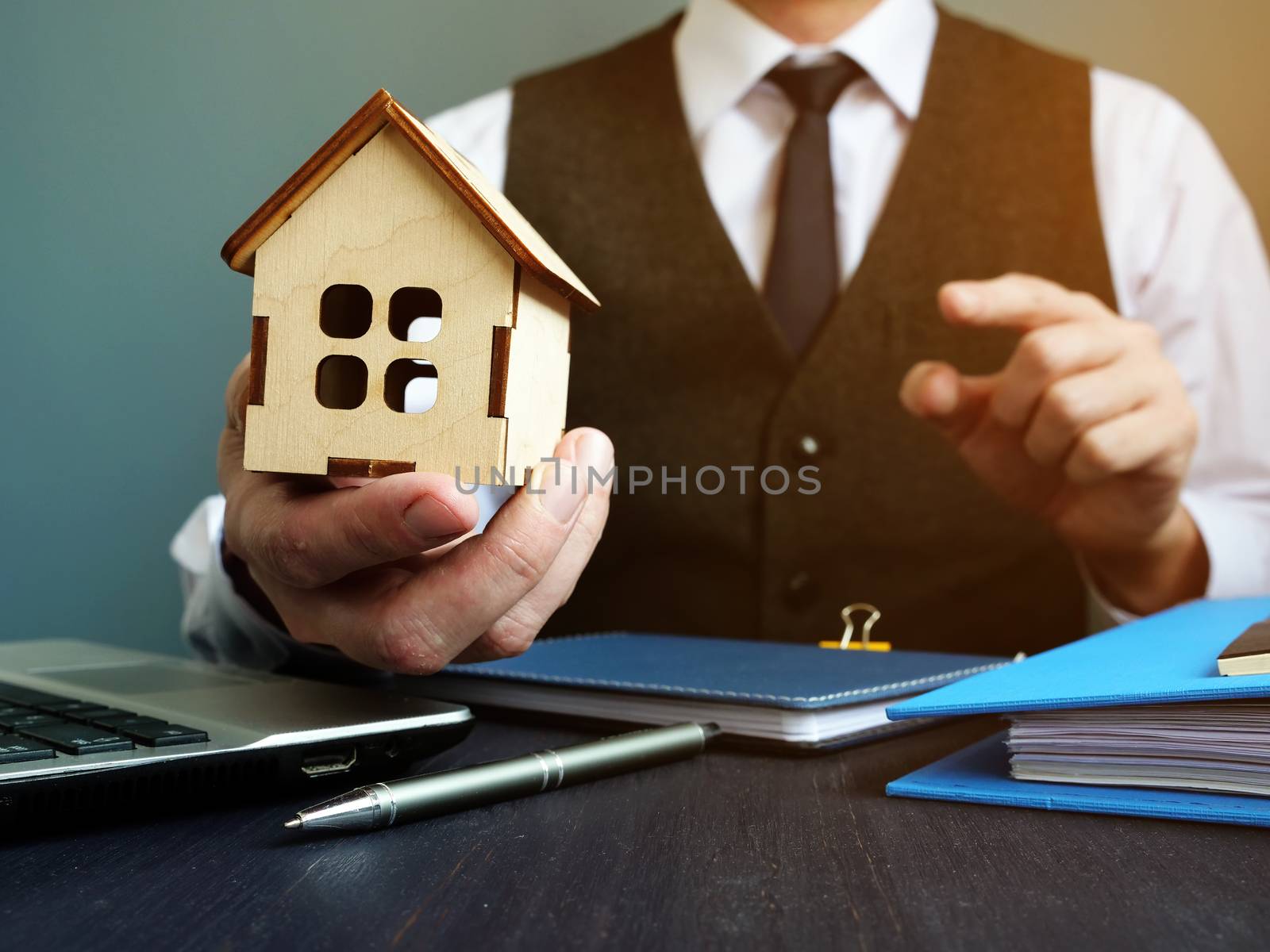 Buy home or get mortgage. Realtor proposes model of house.