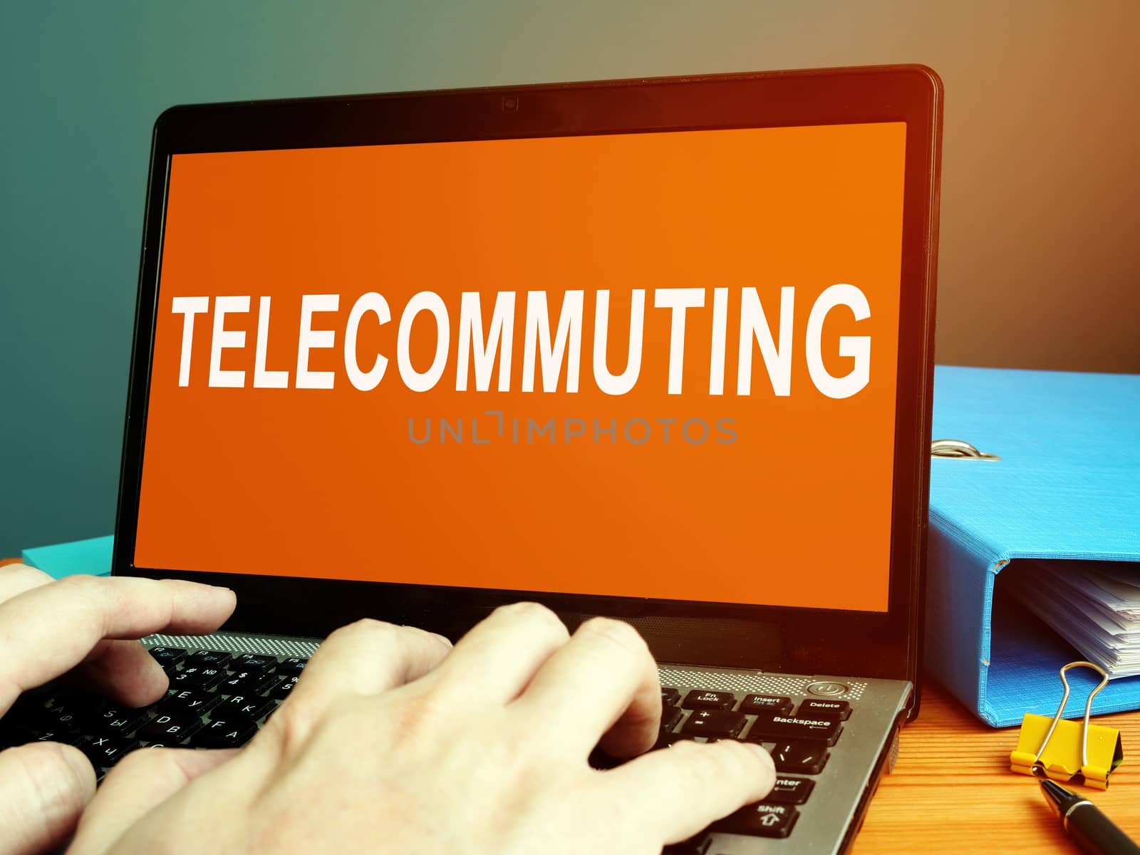 Telecommuting word on the laptop screen.