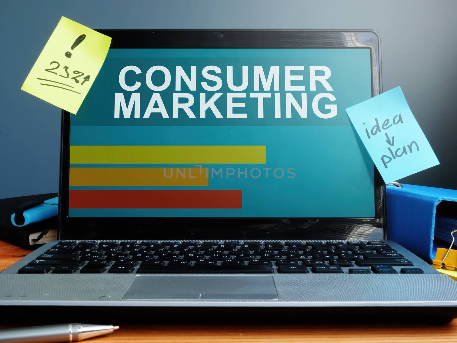 Laptop with consumer marketing report and ideas.