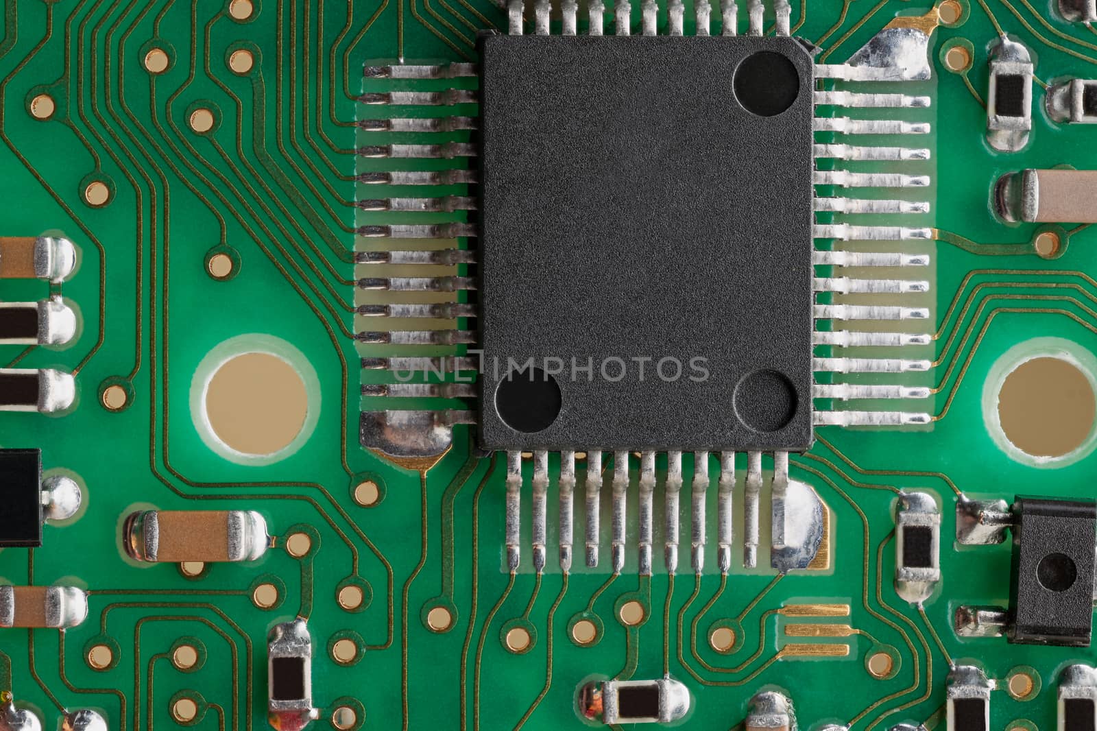 PCB board supermacro close-up. Many capacitors, resistors on board. Digital engineering photo. Flash microprocessor on photo. 