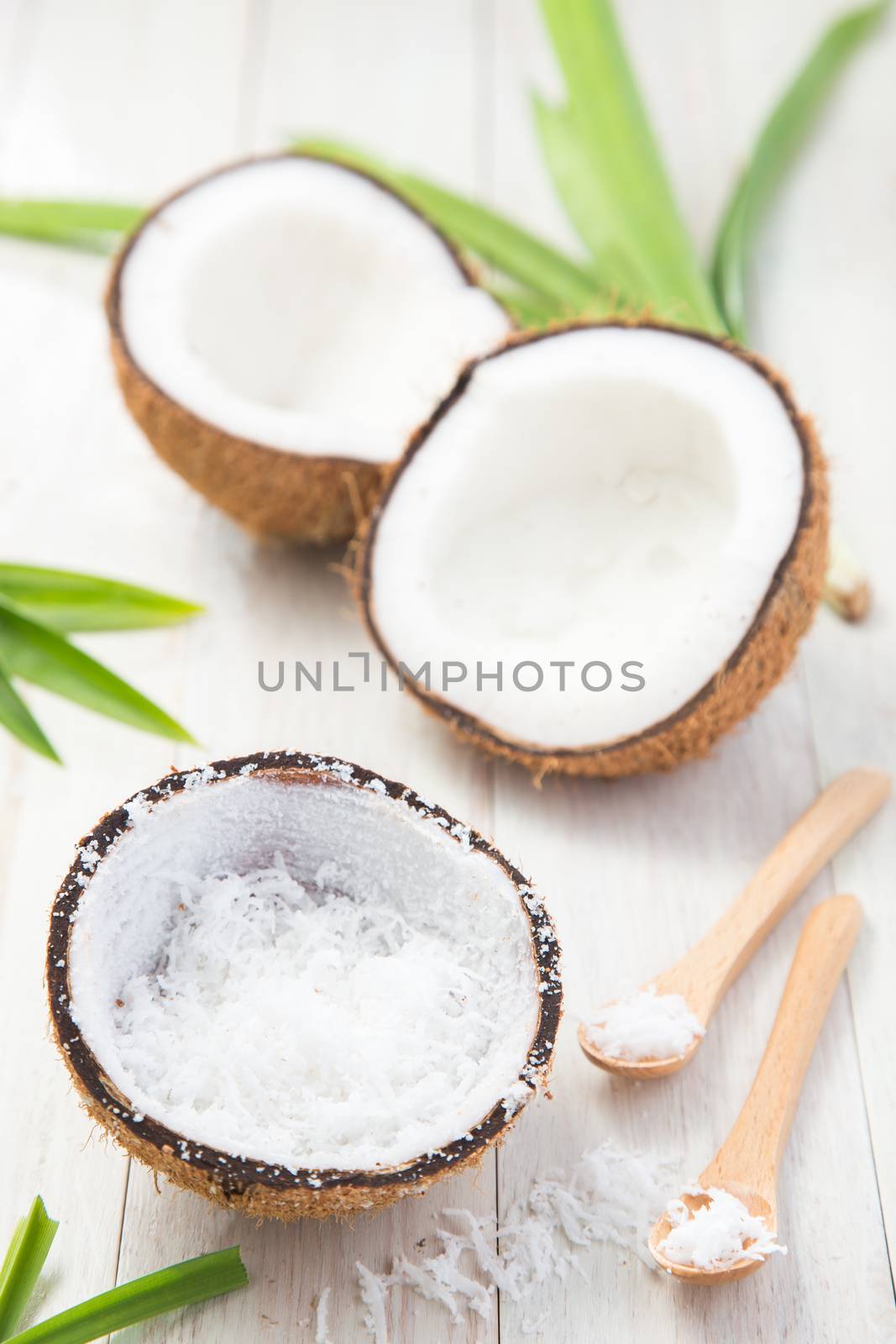 Coconut on white wooden background