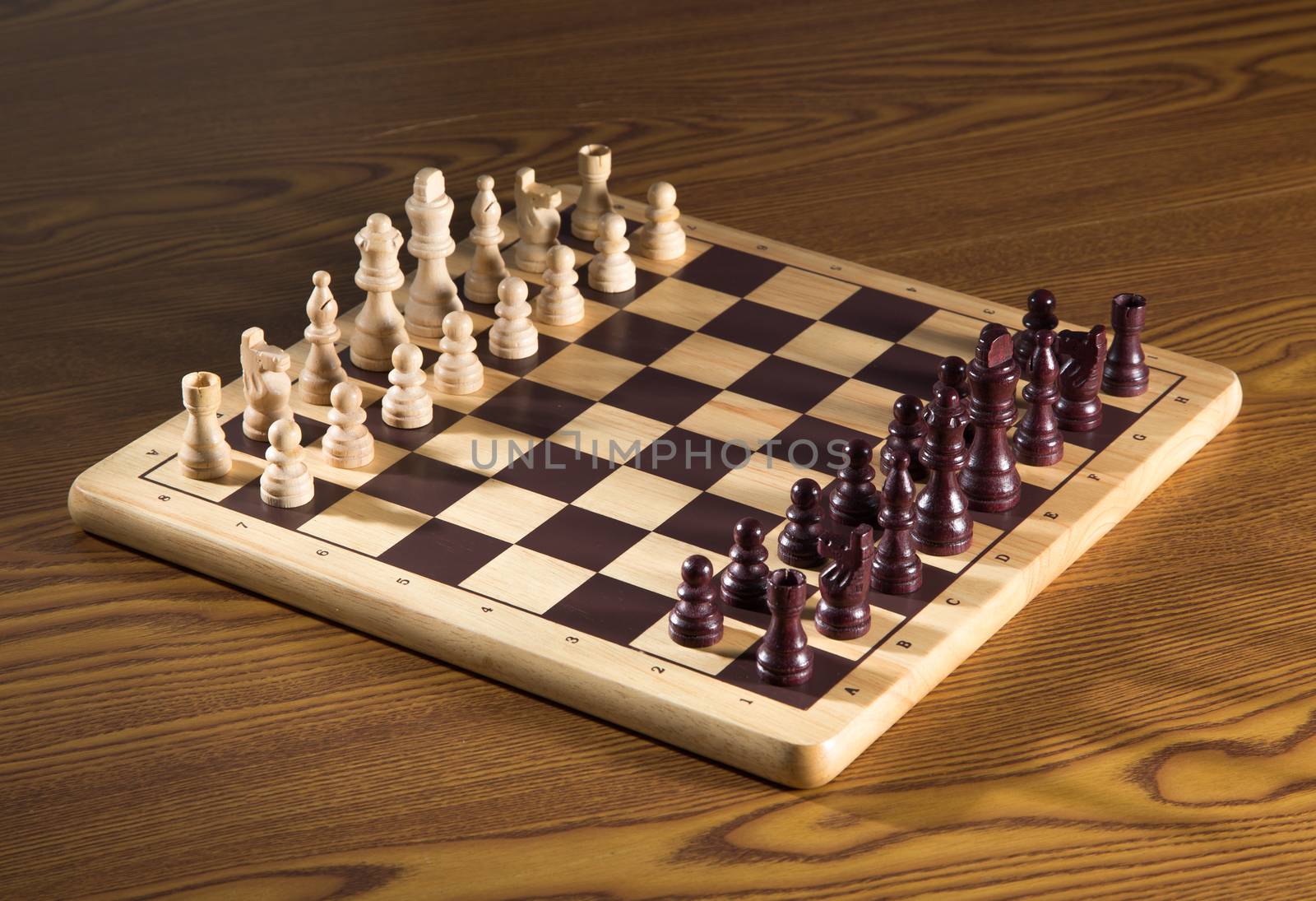 Chess board with chess wooden pieces