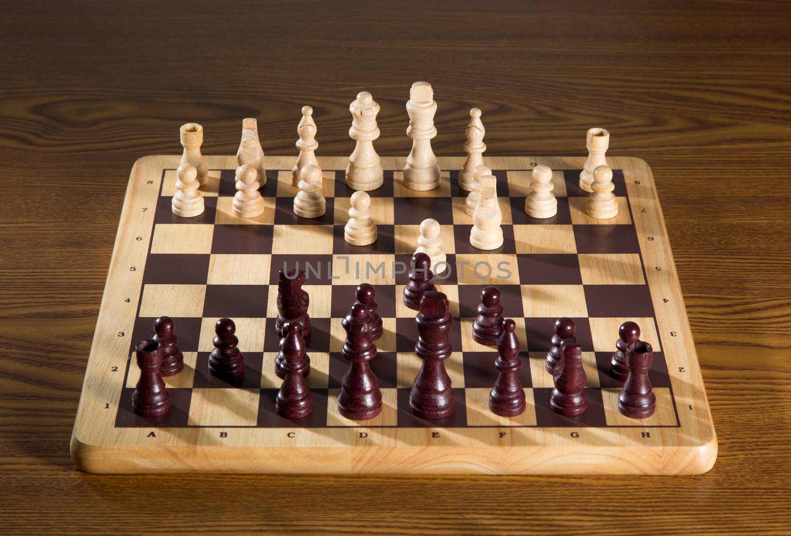 Chess board with chess wooden pieces