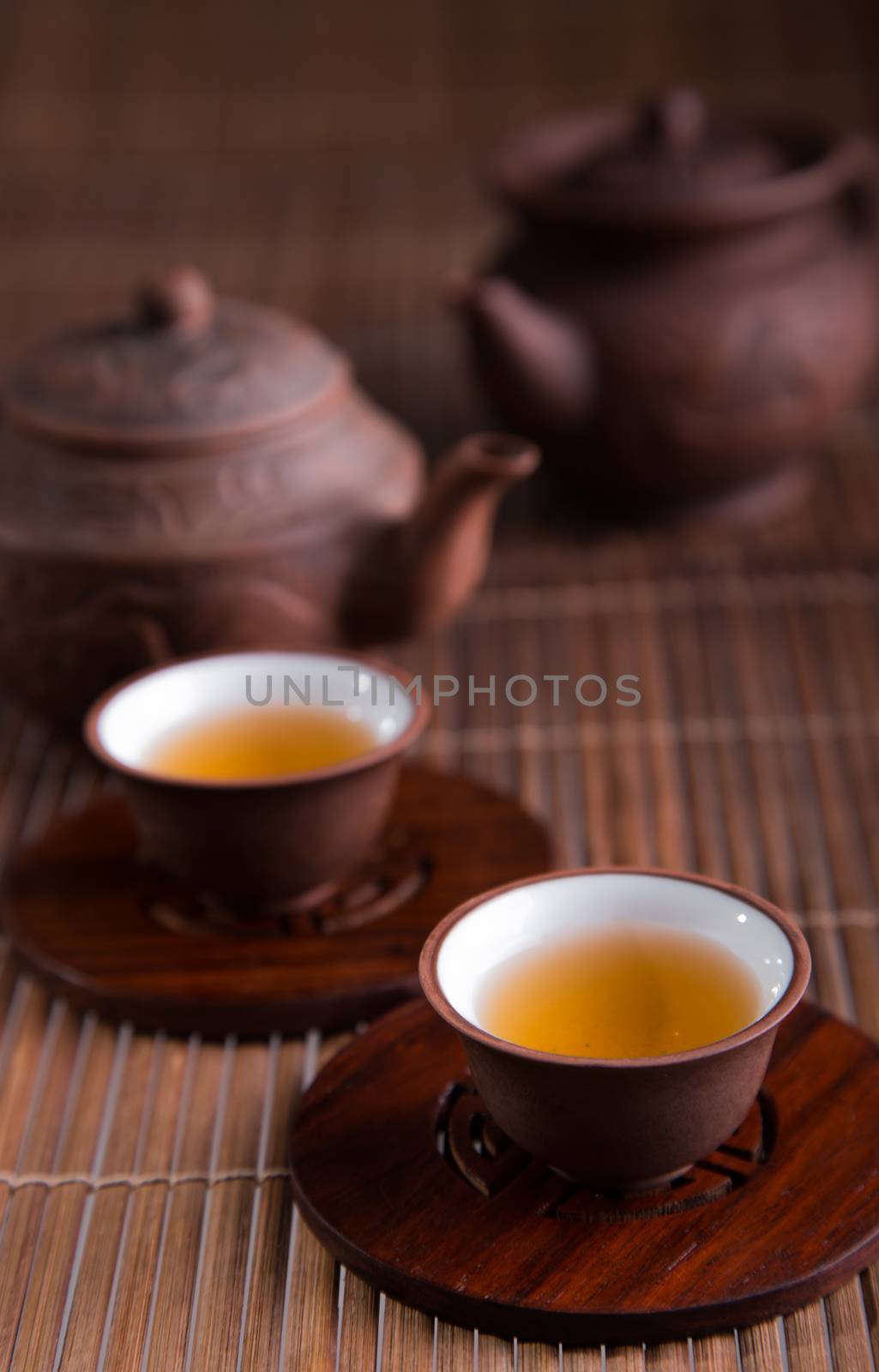 Chinese teapot and teacups set isolated on white