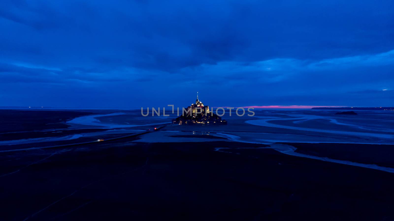 Aerial drone view of Mont Saint Michel bay, France 10-9-19 during summer evening