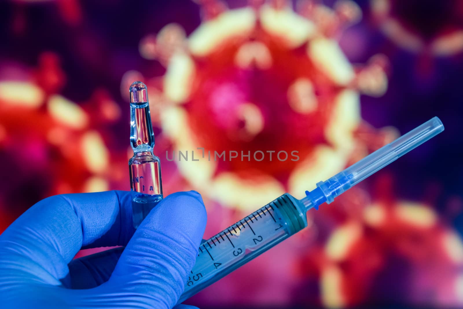 Coronavirus vaccine. A hand in medical gloves holds a vaccine and a syringe against the background of the image of a coronavirus. covid-19,