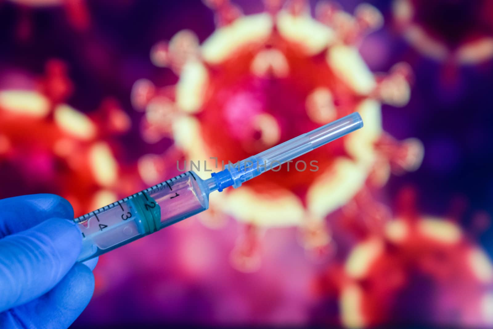 Coronavirus vaccine. A hand in medical gloves holds a vaccine and a syringe against the background of the image of a coronavirus. covid-19,