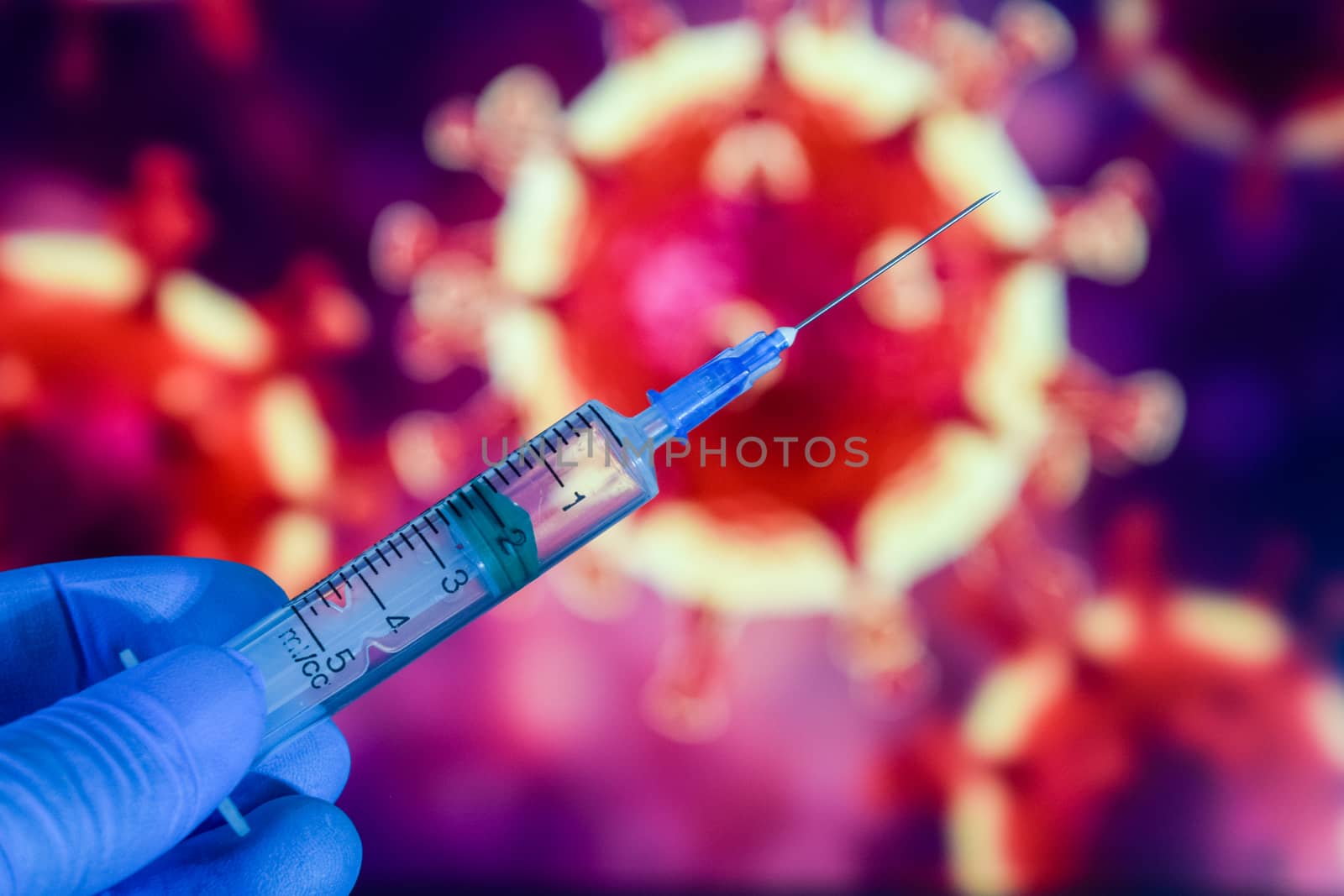 Coronavirus vaccine. A hand in medical gloves holds a vaccine and a syringe against the background of the image of a coronavirus. covid-19,