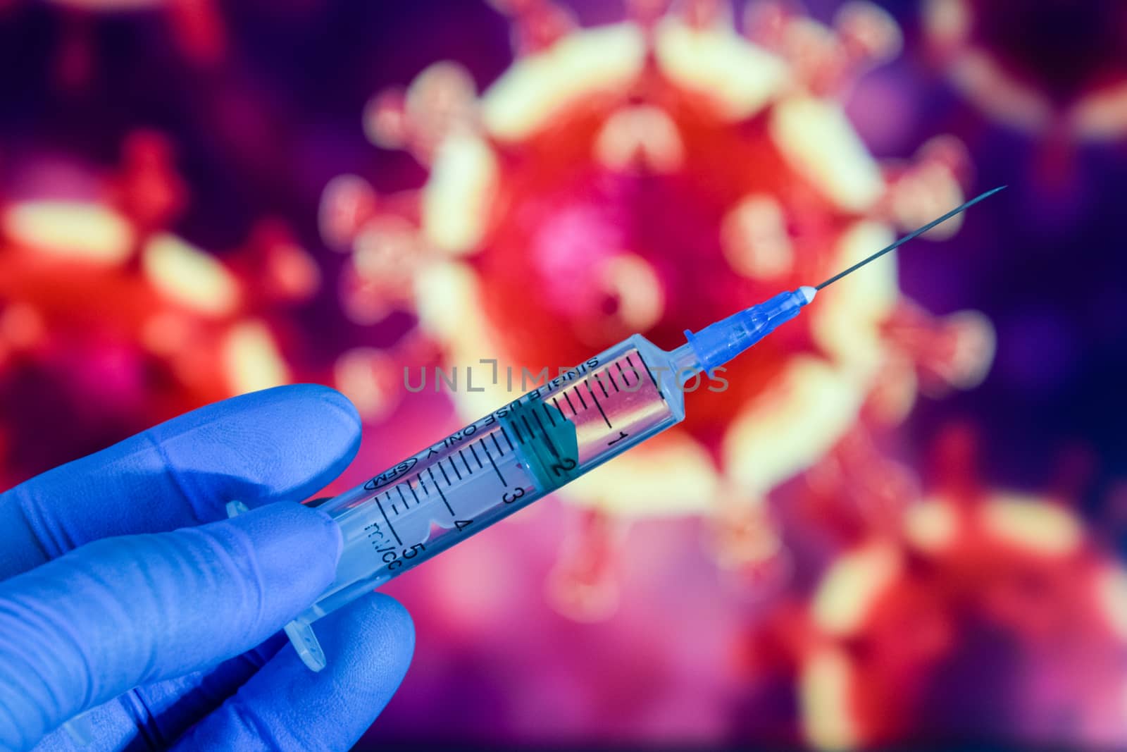 Coronavirus vaccine. A hand in medical gloves holds a vaccine and a syringe against the background of the image of a coronavirus. covid-19,