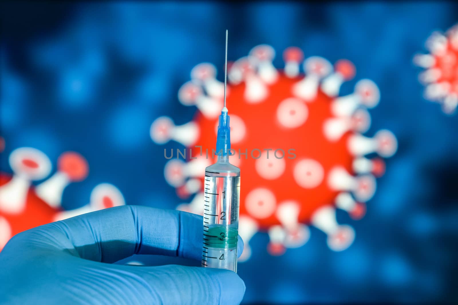 Coronavirus vaccine. A hand in medical gloves holds a vaccine and a syringe against the background of the image of a coronavirus. covid-19,