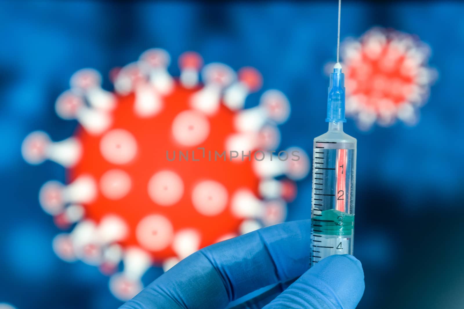 Coronavirus vaccine. A hand in medical gloves holds a vaccine and a syringe against the background of the image of a coronavirus. covid-19,