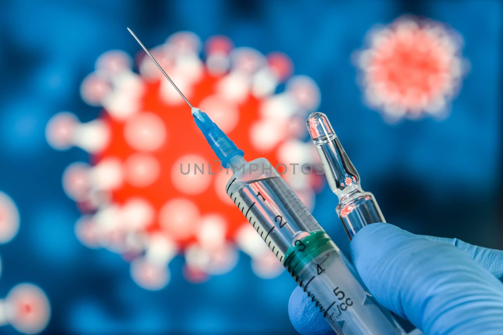 Coronavirus vaccine. A hand in medical gloves holds a vaccine and a syringe against the background of the image of a coronavirus. covid-19,