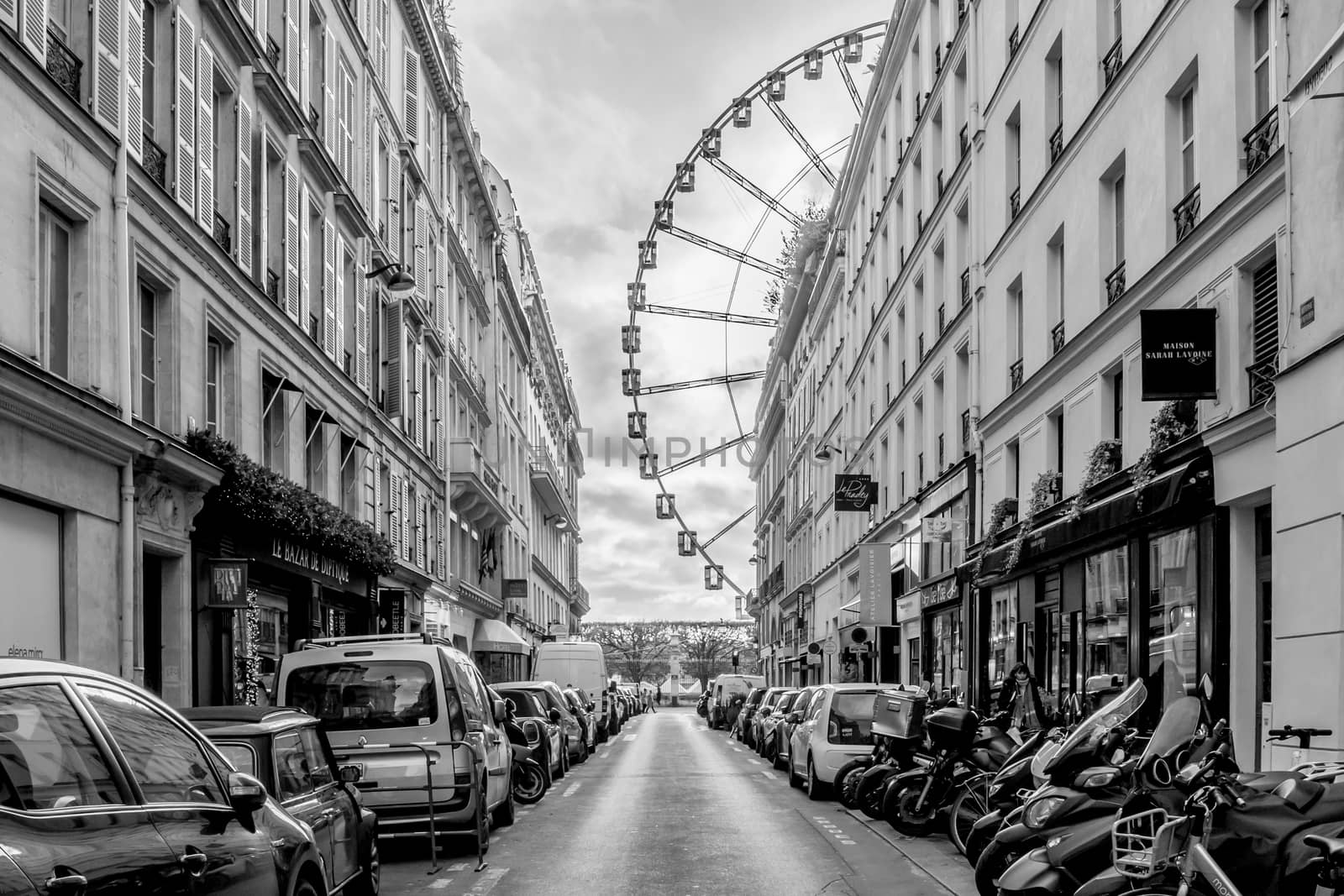 "Roue de la Concorde", Wheel of Concorde square in french, very famous Attraction in paris, view from " Rue saint Honoré ". Black and white picture