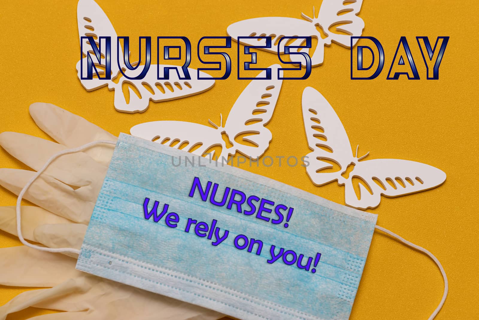 The text of the greeting on the medical holiday-the day of the nurse is written on a blue antiviral bandage by bonilook