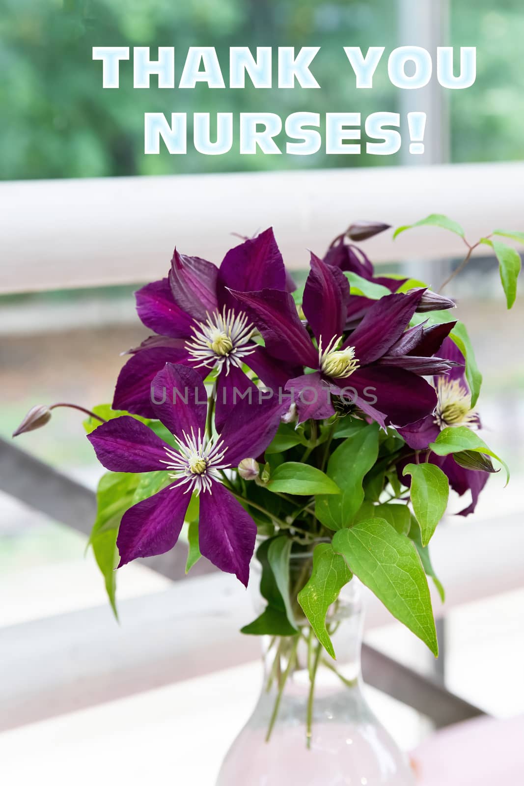 The text of the greeting on the medical holiday-the day of the nurse is written on the background of a beautiful bouquet of flowers. by bonilook