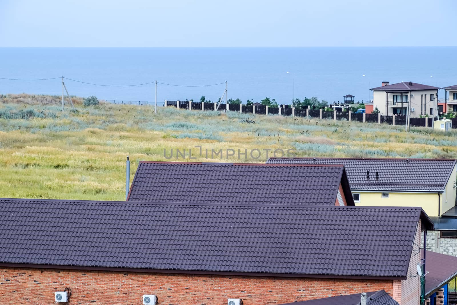 Roof made of metal. Construction with modern roofing materials. Corrugated metal profile.