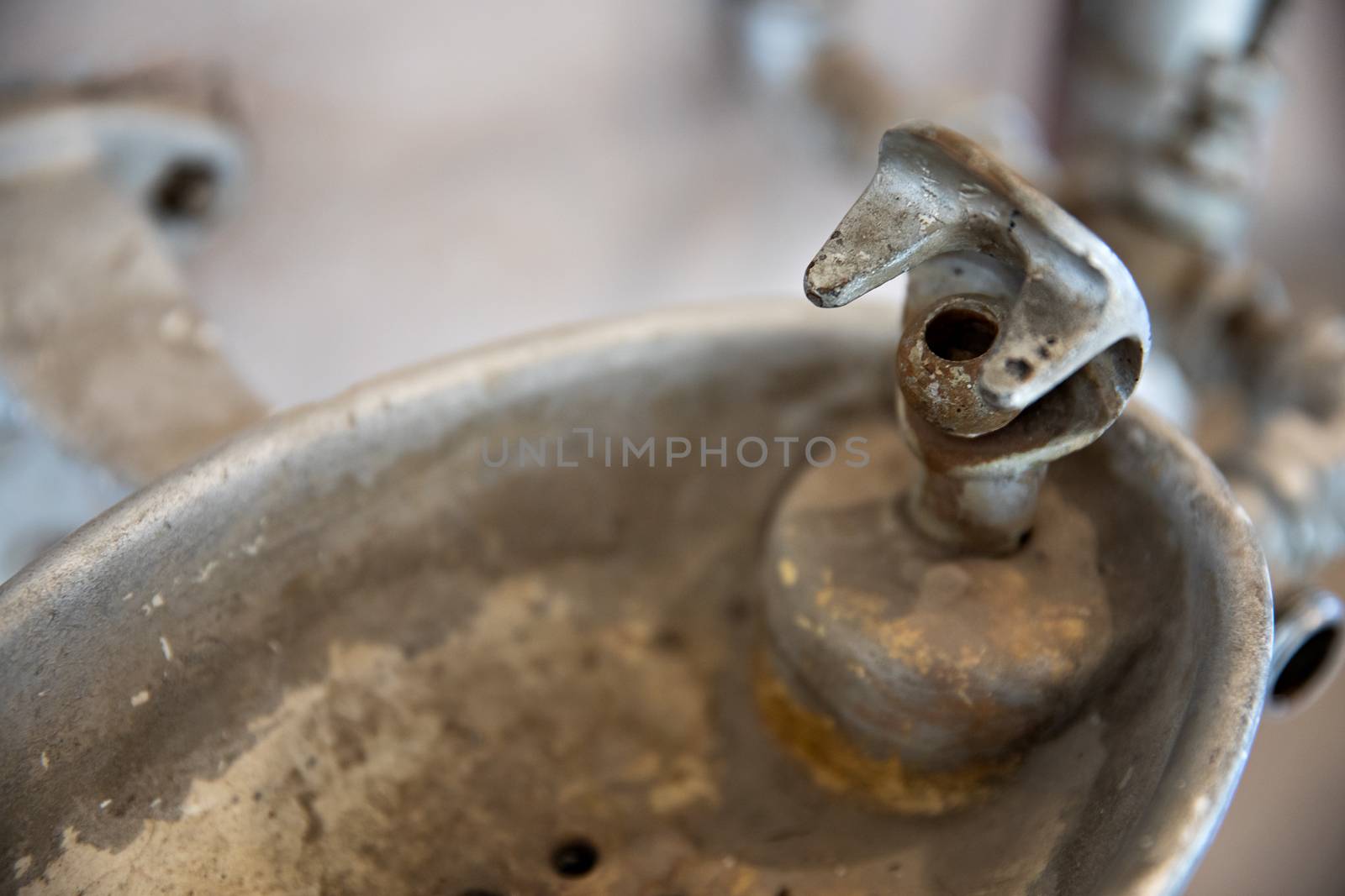 Water fountain that is very dirty and unhygenic