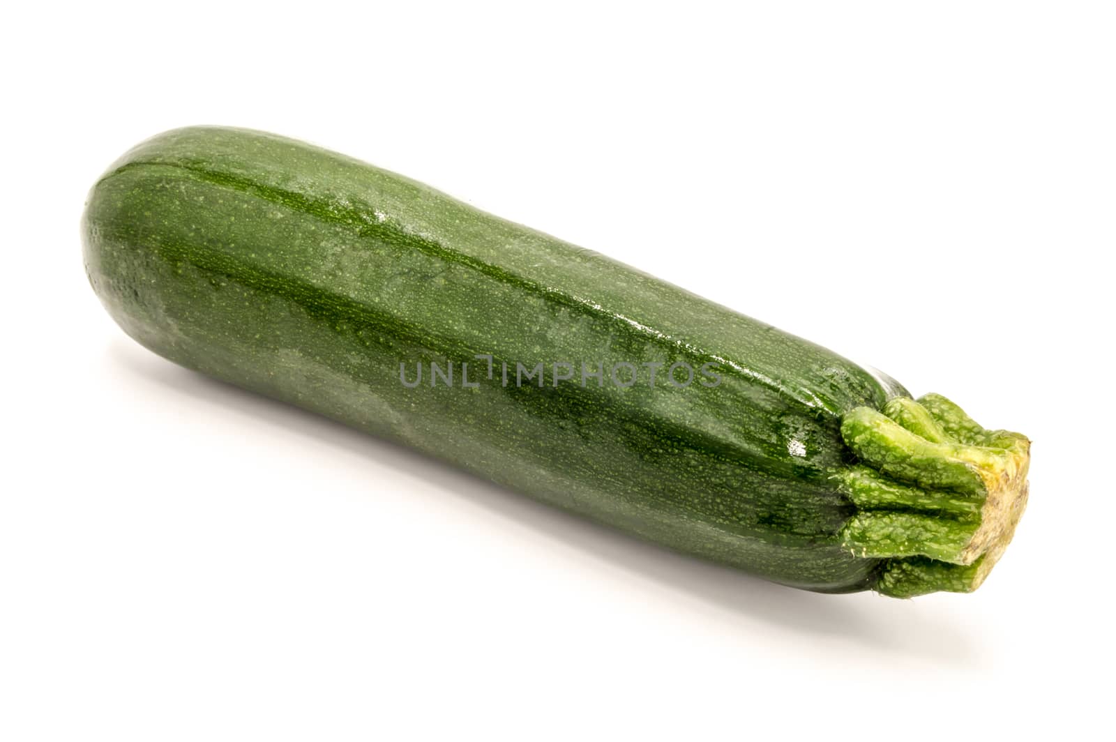Close-up of a fresh zucchini on a white background