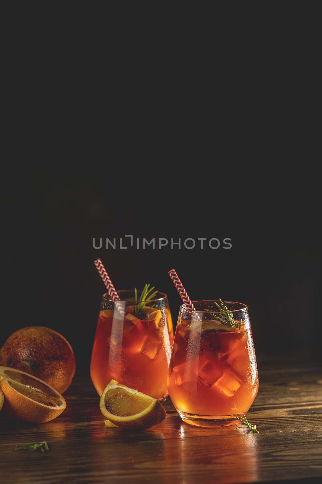 Two glasses with water drops of campari gin spritz. Cocktail of  by ArtSvitlyna