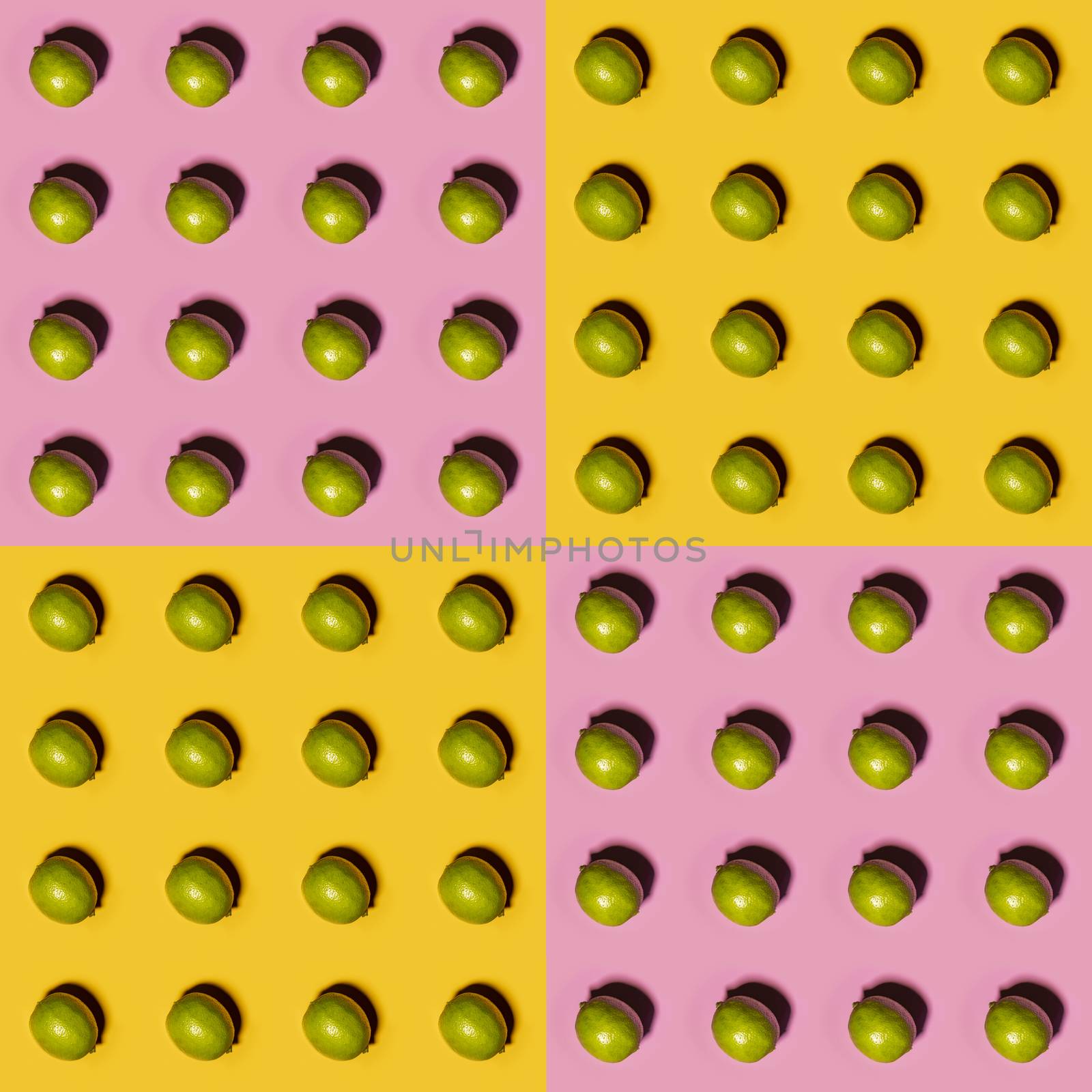 Limes pattern on yellow and pink background. Creative food concept. Flat lay.