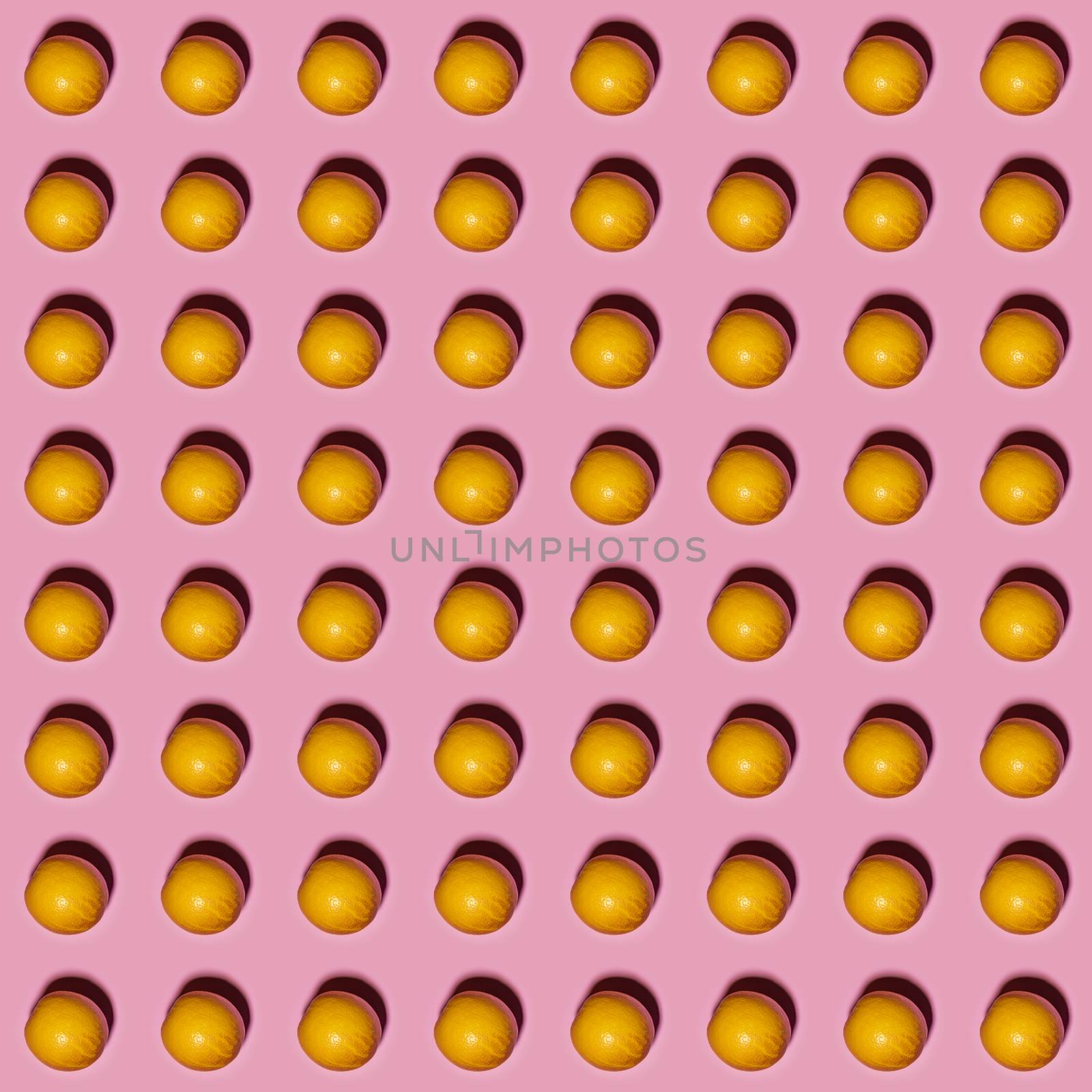 Orange pattern on pink background. Creative food concept. Flat lay.