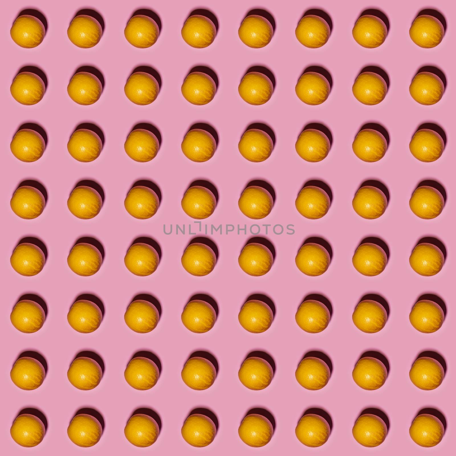Orange pattern on pink background. Creative food concept. Flat lay.