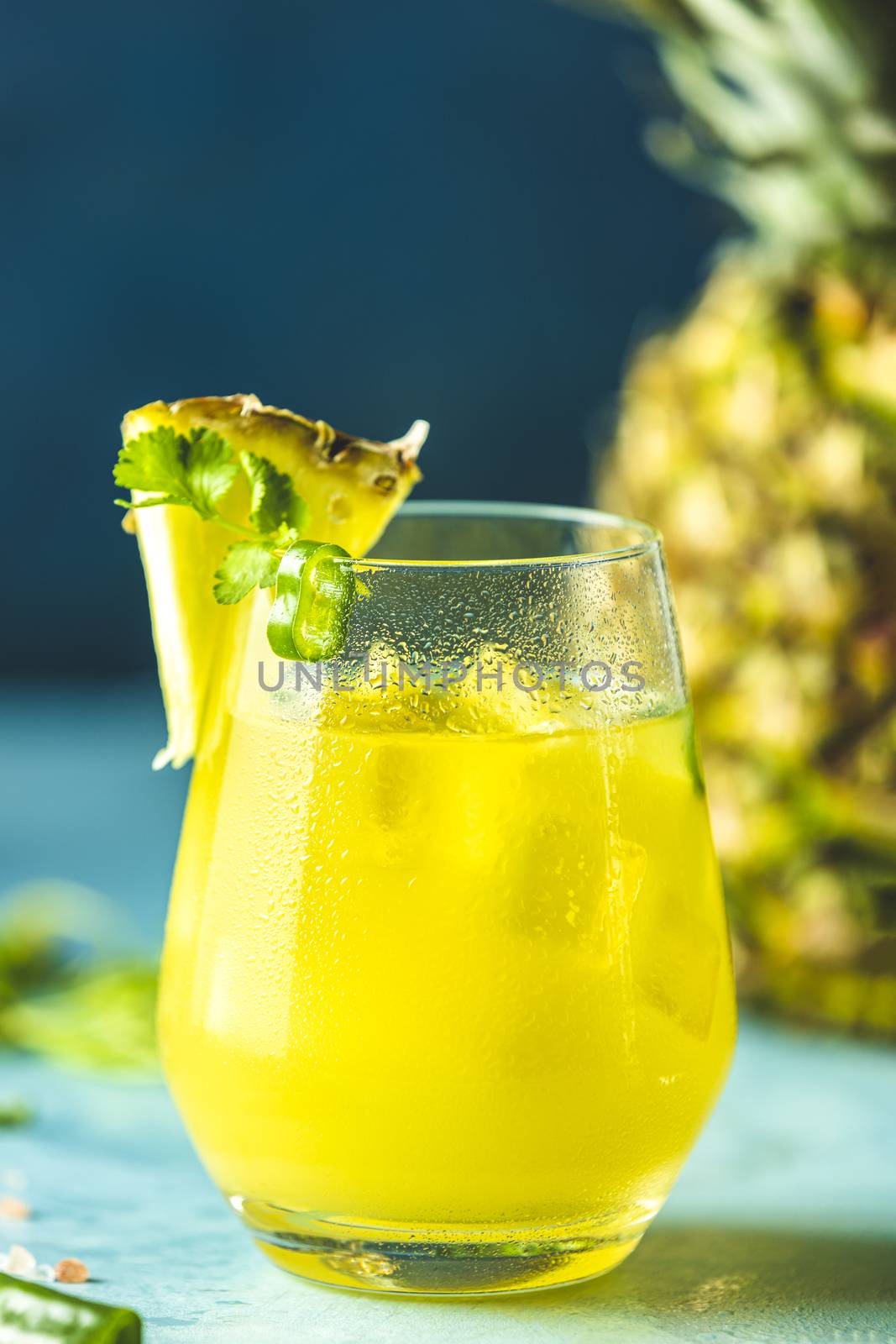 Glass of spicy pineapple jalapeno mezcalita or margarita for Cin by ArtSvitlyna