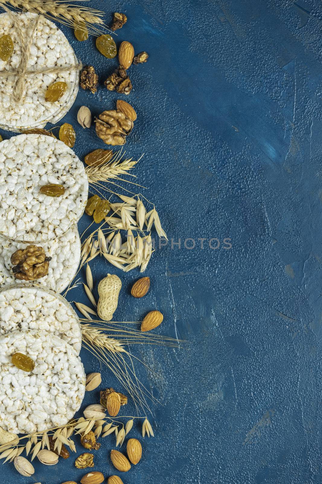 American puffed rice cakes. Healthy snacks with ears of wheat on by ArtSvitlyna