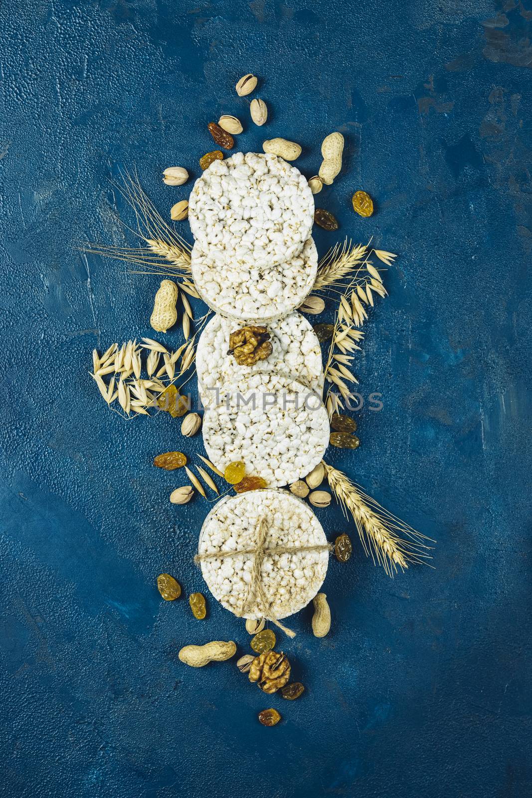 American puffed rice cakes. Healthy snacks with ears of wheat on by ArtSvitlyna