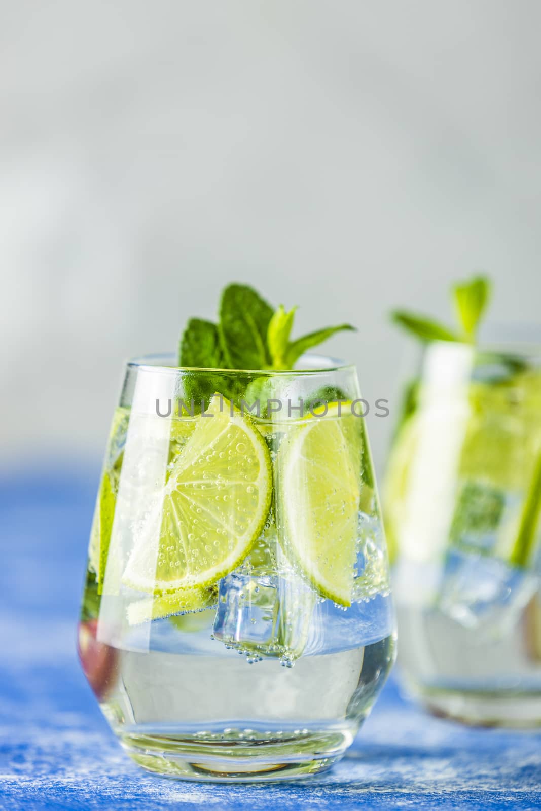 Two detox water or mojito close up. Summer bright drinks with mi by ArtSvitlyna