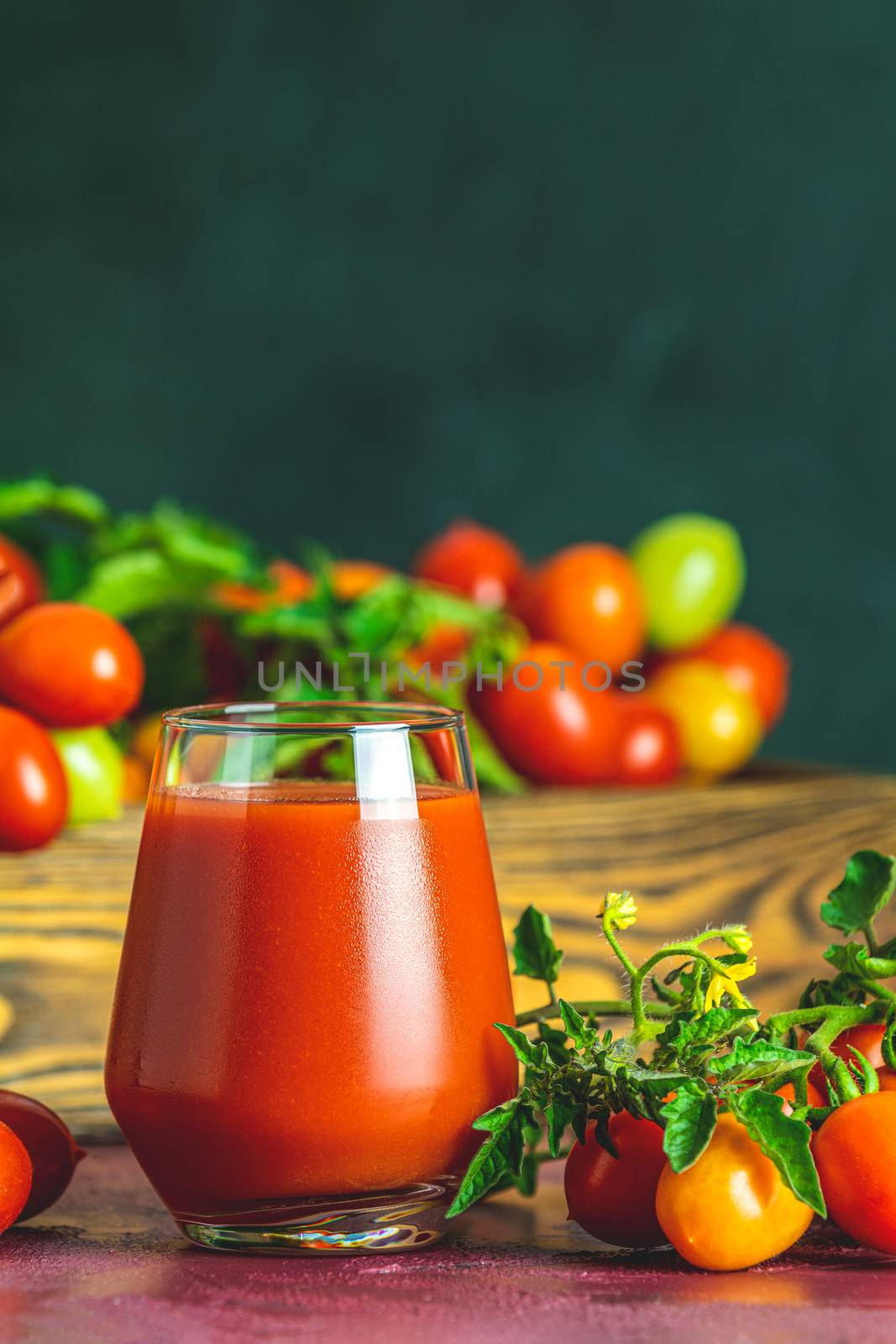 Glass of fresh delicious jummy red tomato juice and fresh tomato by ArtSvitlyna