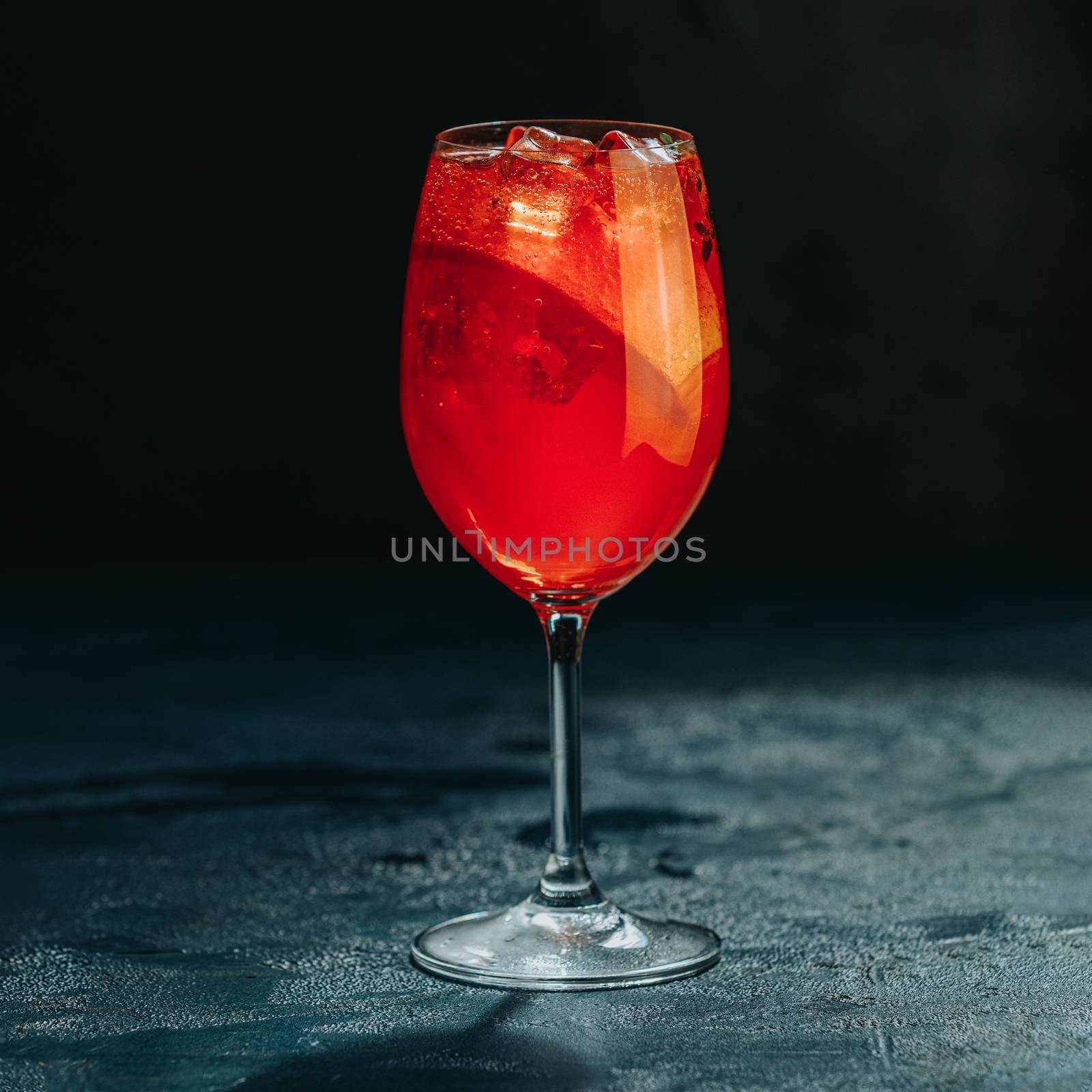 Cocktail aperol spritz on dark background.. Sunlight. Summer alc by ArtSvitlyna