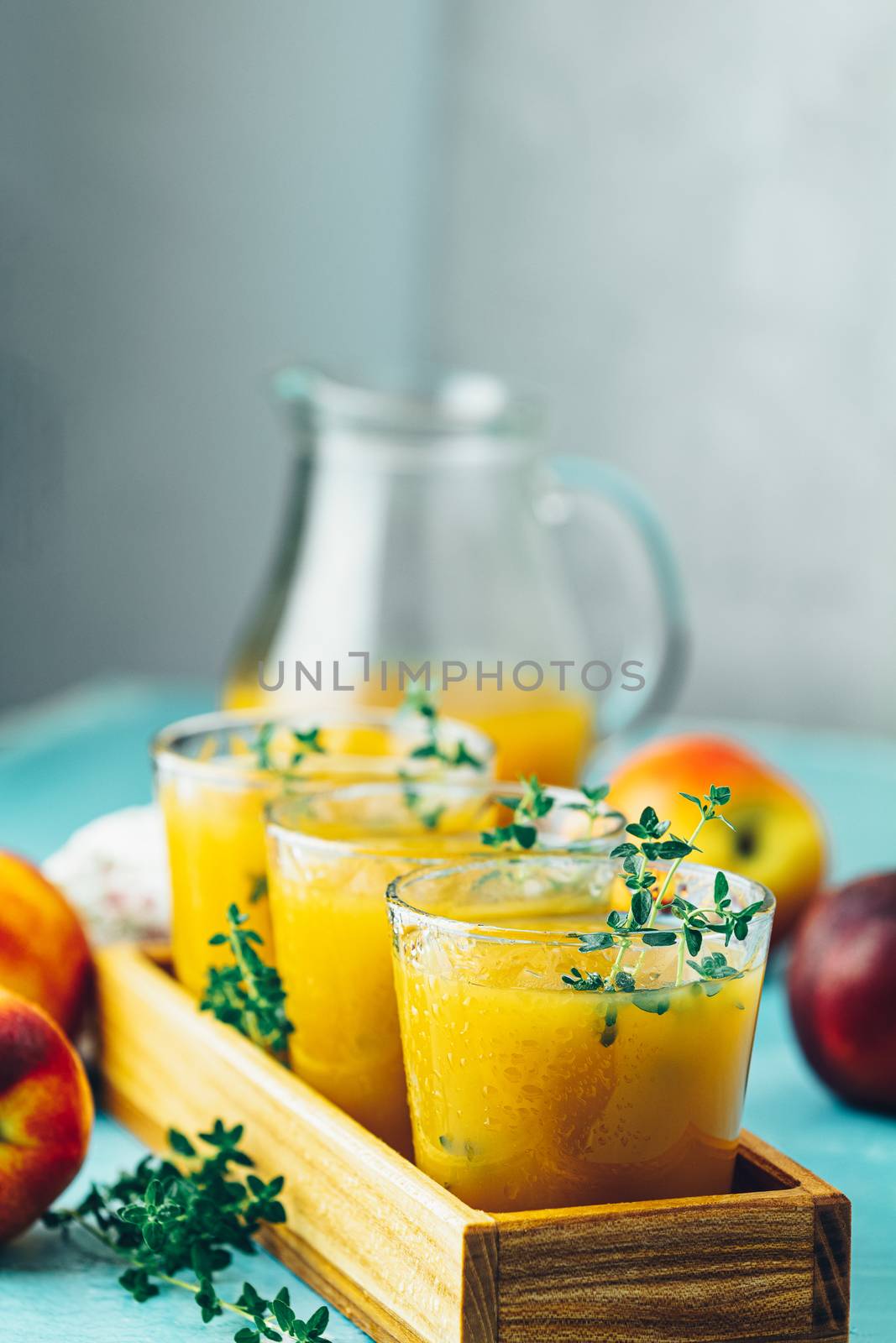 Glass of fresh healthy peach smoothie or juice by ArtSvitlyna