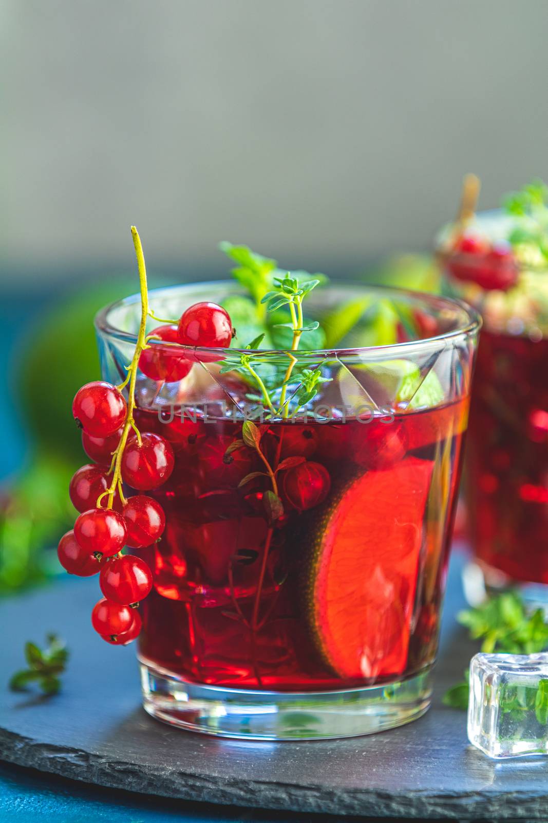 Cold red cocktail in glass with currant by ArtSvitlyna