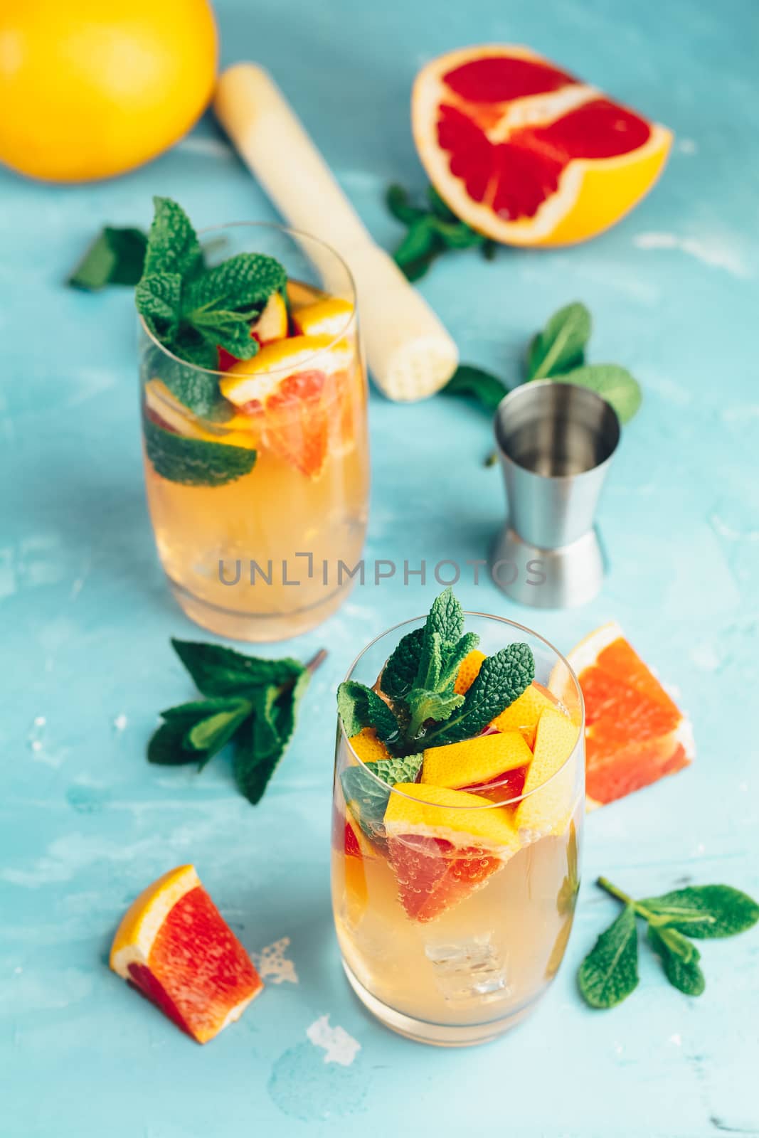 Grapefruit and fresh mint cocktail with juice by ArtSvitlyna