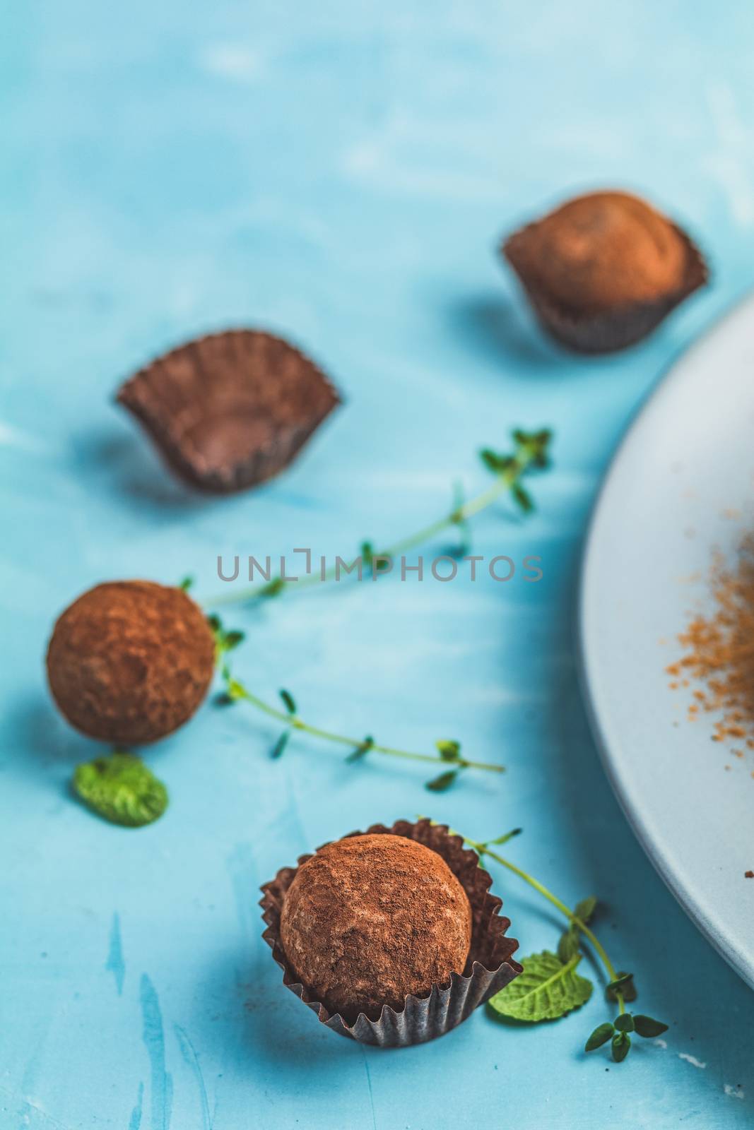 Cocoa balls, handmade chocolate balls cakes in a blue tray by ArtSvitlyna
