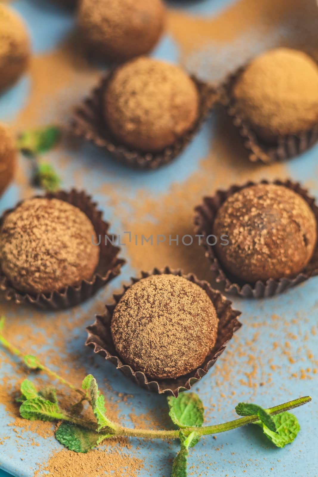 Cocoa balls, handmade chocolate balls cakes in a blue tray by ArtSvitlyna