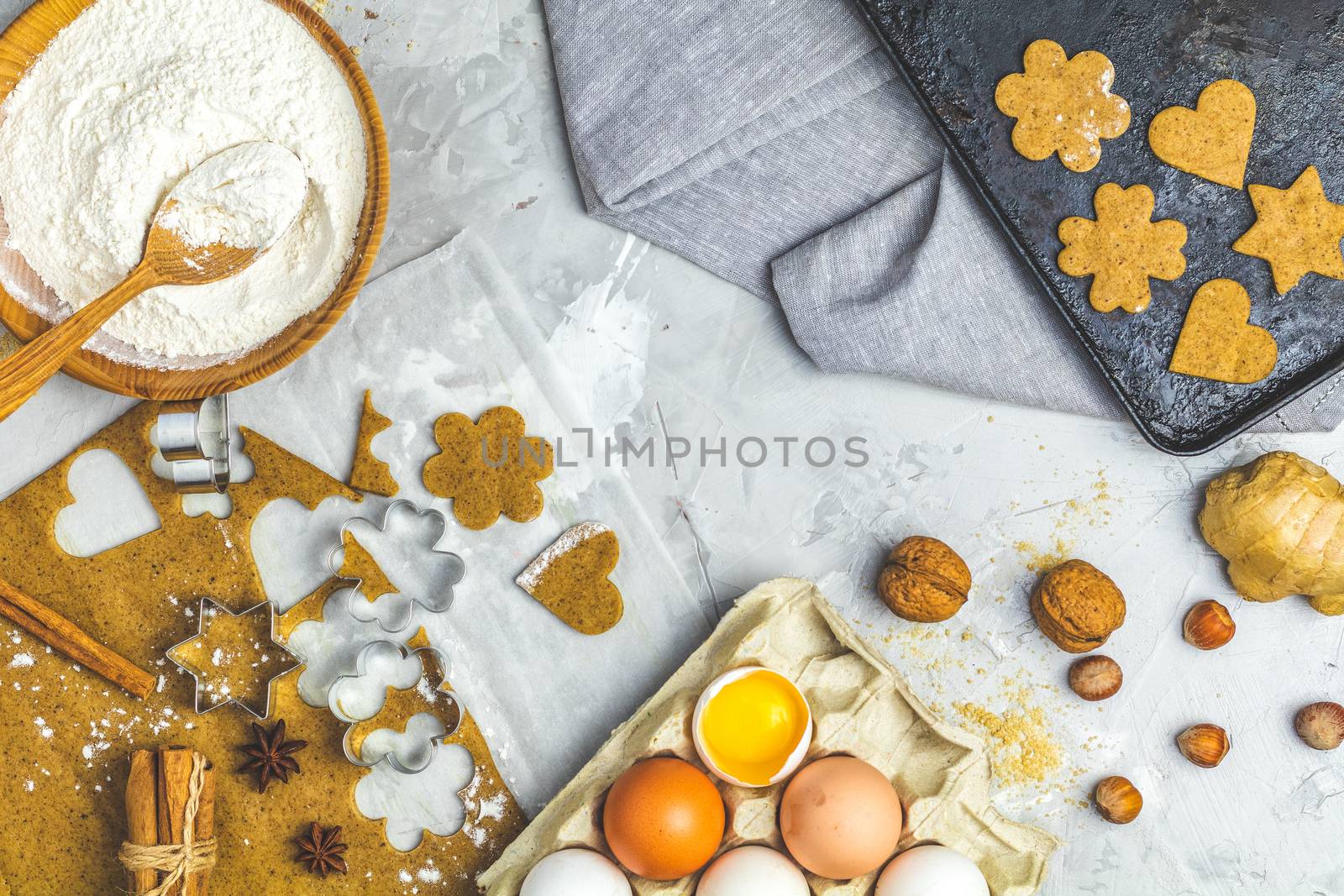 Culinary Spring or Christmas food background. Ingredients for ginger cookies. Dough for baking, brown sugar, flour, eggs. View from above.